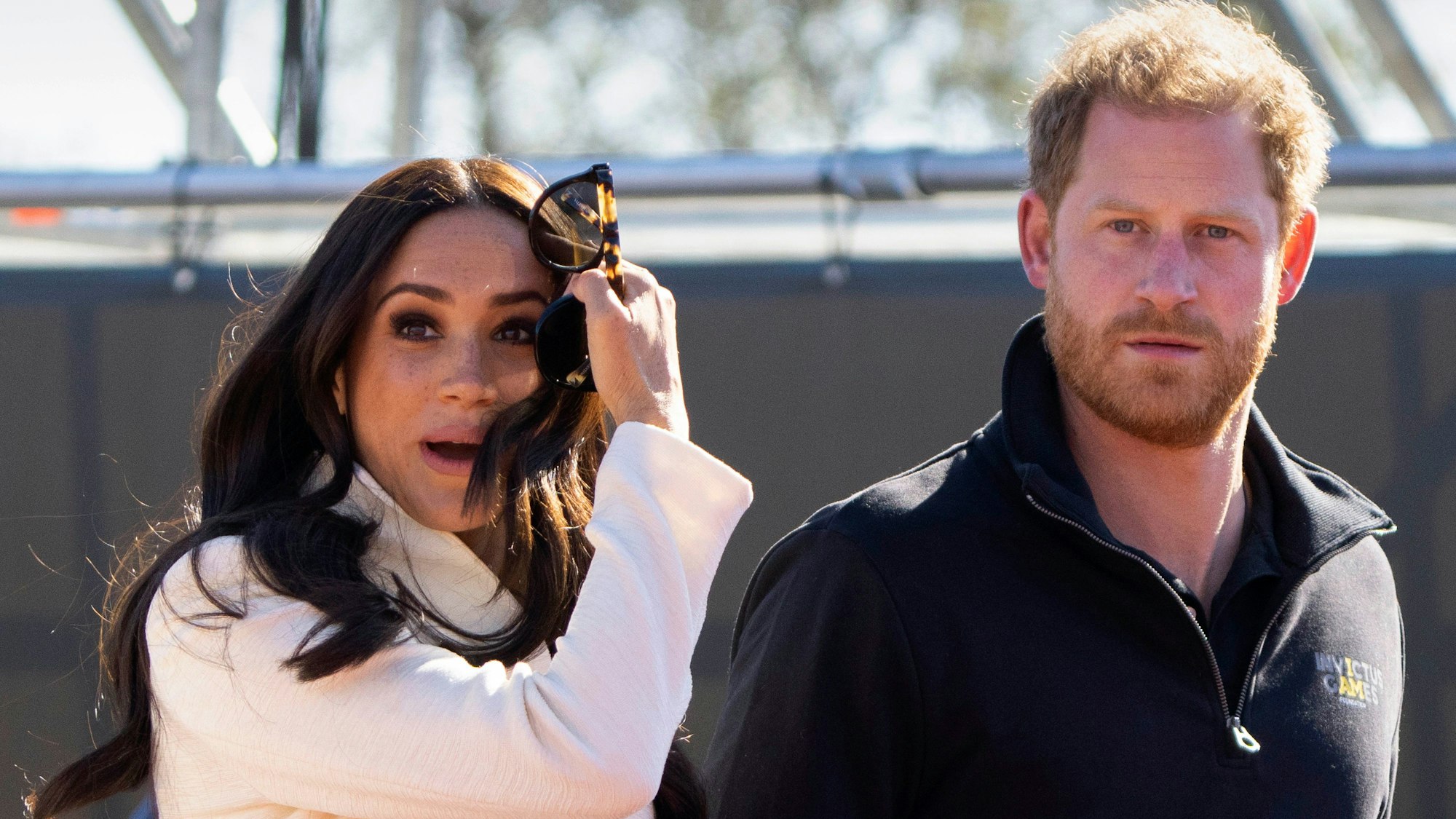FILE - Prince Harry and Meghan Markle, Duke and Duchess of Sussex visit the track and field event at the Invictus Games in The Hague, Netherlands, Sunday, April 17, 2022. Prince Harry and his wife, Meghan, are expected to vent their grievances against the monarchy when Netflix releases the final episodes of a series about the couple’s decision to step away from royal duties and make a new start in America. (AP Photo/Peter Dejong, File)