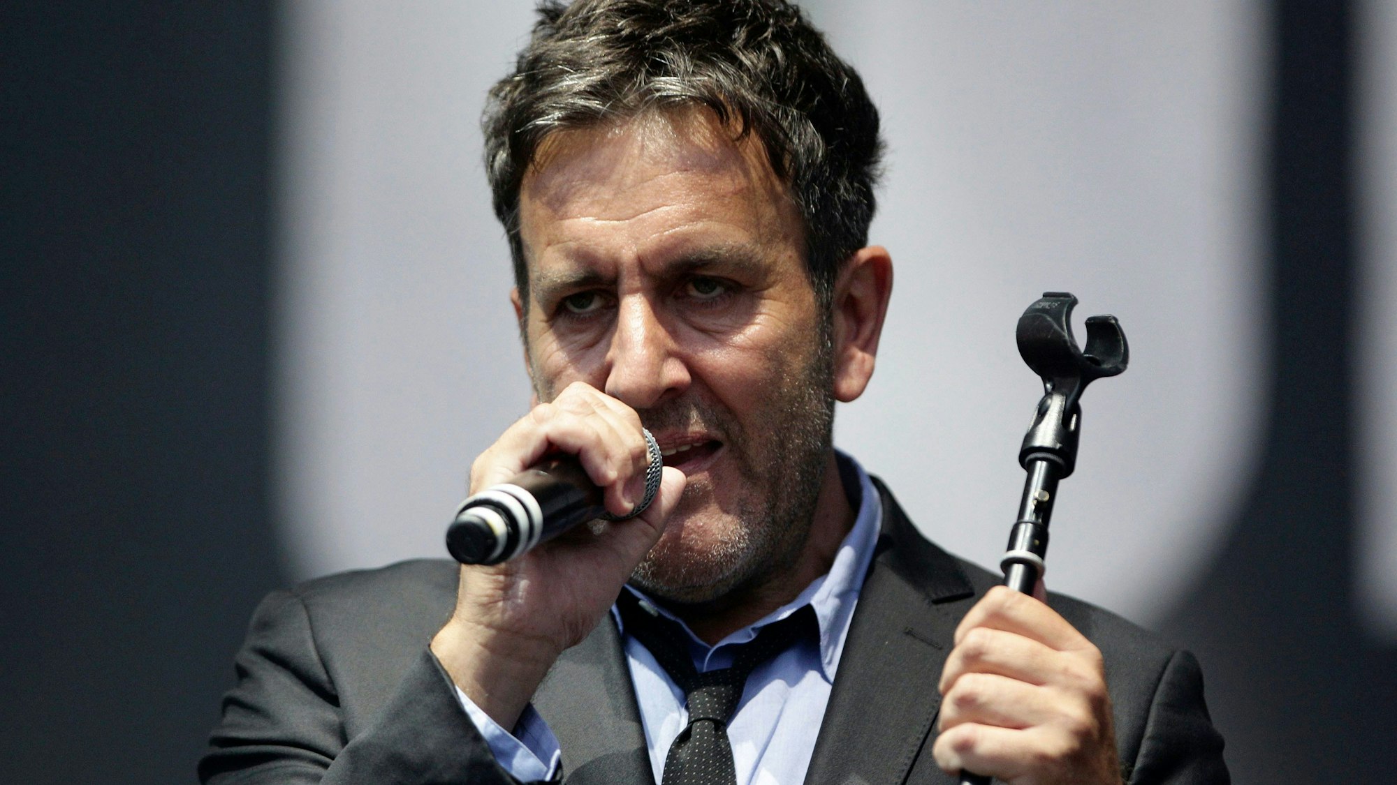 Musician Terry Hall of The Specials performs on the Main Stage, at the Isle of Wight Festival in Seaclose Park, Newport, Isle of Wight, England, on June 14, 2014. Hall, the lead singer of The Specials, died at the age of 63 following a brief illness, the band announced late Monday, Dec. 19, 2022. (Yui Mok/PA via AP)