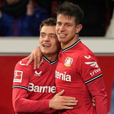 Leverkusen's Adam Hlozak, right, celebrates with Leverkusen's Florian Wirtz after scoring his side's second goal during the German Bundesliga soccer match between Bayer Leverkusen and VfL Bochum in Leverkusen, Germany, Germany, Wednesday, Jan. 25, 2023. (AP Photo/Martin Meissner)