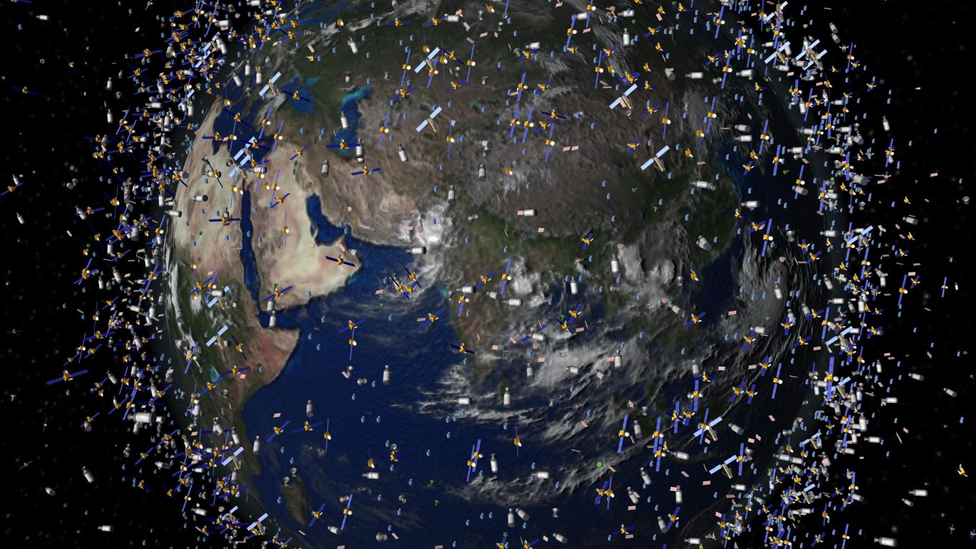 Das computergenerierte Bild der European Space Agency (ESA) zeigt Weltraummüll früherer Weltraummissionen, der neben intakten Satelliten um die Erde kreist (Foto undatiert).