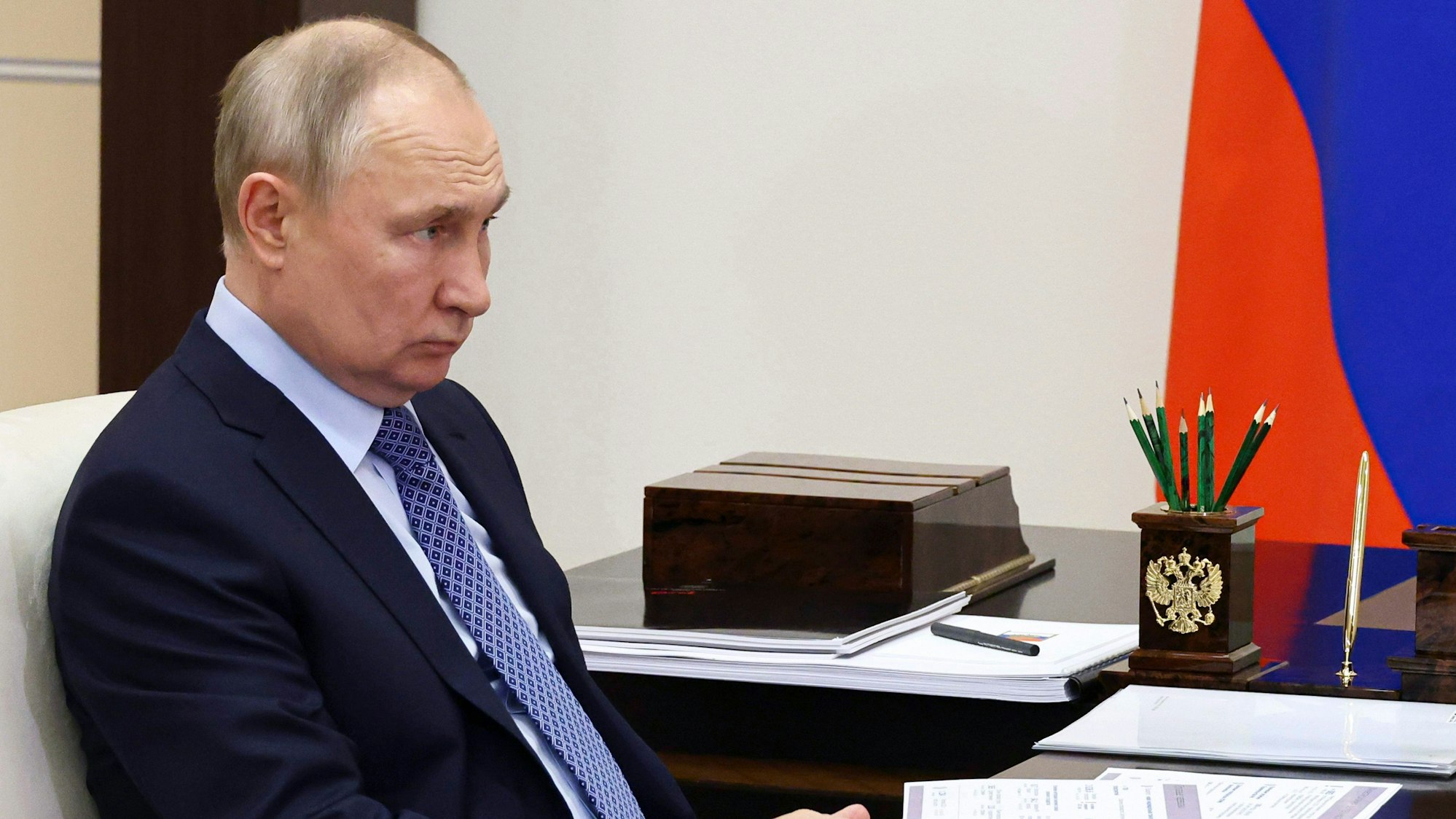 Russian President Vladimir Putin listens to Russian Railways CEO Oleg Belozerov during their meeting at the Novo-Ogaryovo state residence outside Moscow, Russia, Monday, Feb. 6, 2023. (Mikhail Klimentyev, Sputnik, Kremlin Pool Photo via AP)