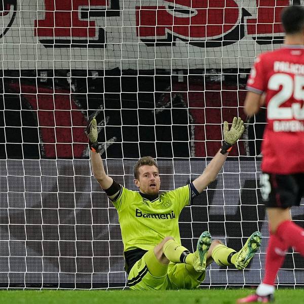 Leverkusen's goalkeeper Lukas Hradecky reacts after he scored an own goal during the Europa League playoff first leg soccer match' between Bayer Leverkusen and AS Monaco in Leverkusen, Germany, Thursday, Feb. 16, 2023. (AP Photo/Martin Meissner)
