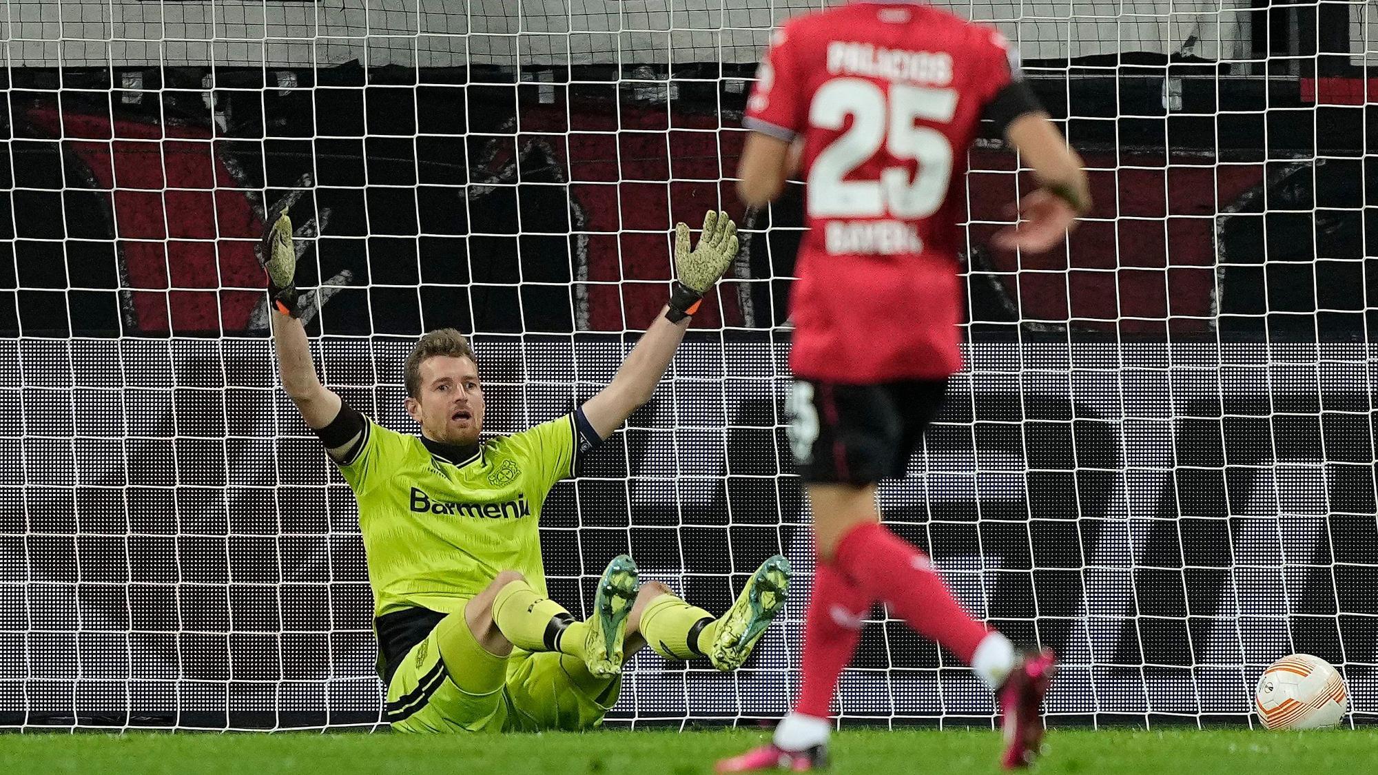 Leverkusen's goalkeeper Lukas Hradecky reacts after he scored an own goal during the Europa League playoff first leg soccer match' between Bayer Leverkusen and AS Monaco in Leverkusen, Germany, Thursday, Feb. 16, 2023. (AP Photo/Martin Meissner)