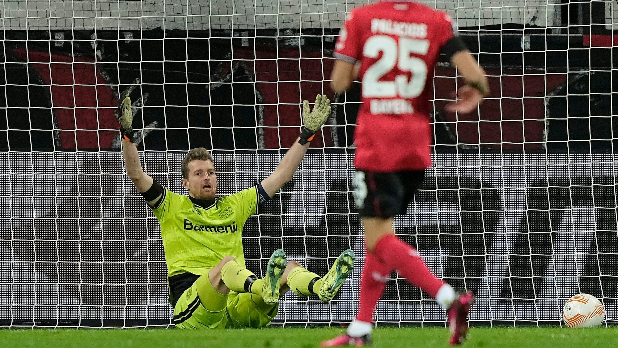Leverkusen's goalkeeper Lukas Hradecky reacts after he scored an own goal during the Europa League playoff first leg soccer match' between Bayer Leverkusen and AS Monaco in Leverkusen, Germany, Thursday, Feb. 16, 2023. (AP Photo/Martin Meissner)
