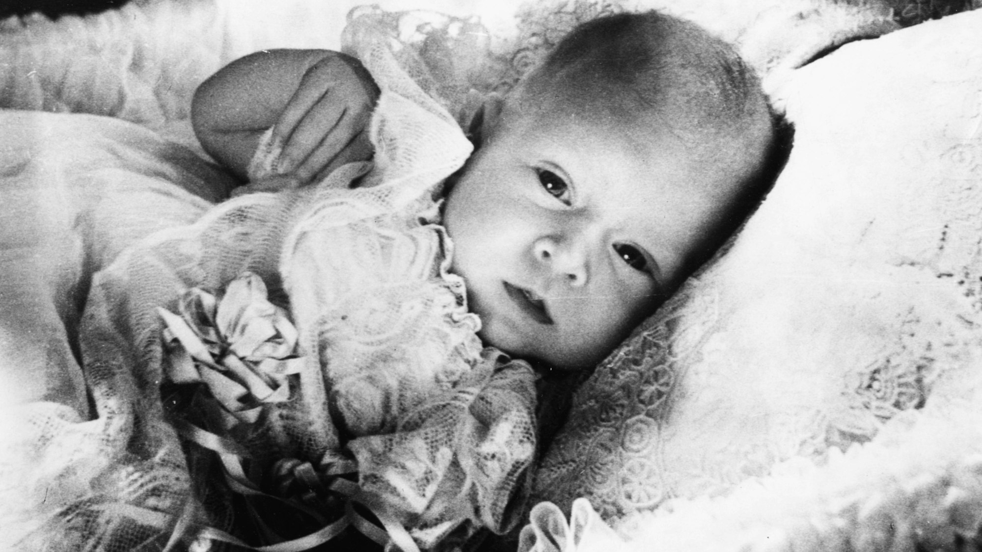 Childhood portrait of the baby Prince Charles in his basket, at Buckingham Palace, London, January 1949. (Photo by Central Press/Hulton Archive/Getty Images)