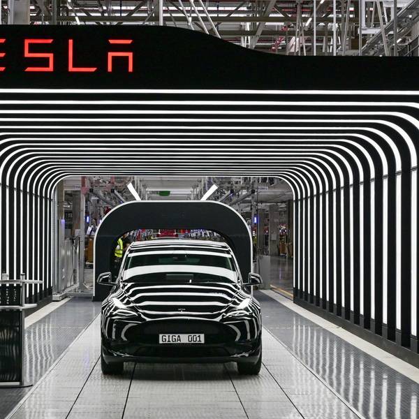 (FILES) In this file photo taken on March 22, 2022, an electric vehicle of the model Y is pictured during the start of the production at Tesla's "Gigafactory" in Gruenheide, southeast of Berlin. - Tesla reported another round of record quarterly profits on January 25, 2023, while confirming its long-term production outlook in spite of concerns about rising competition and macroeconomic headwinds. (Photo by Patrick Pleul / POOL / AFP)