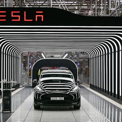(FILES) In this file photo taken on March 22, 2022, an electric vehicle of the model Y is pictured during the start of the production at Tesla's "Gigafactory" in Gruenheide, southeast of Berlin. - Tesla reported another round of record quarterly profits on January 25, 2023, while confirming its long-term production outlook in spite of concerns about rising competition and macroeconomic headwinds. (Photo by Patrick Pleul / POOL / AFP)