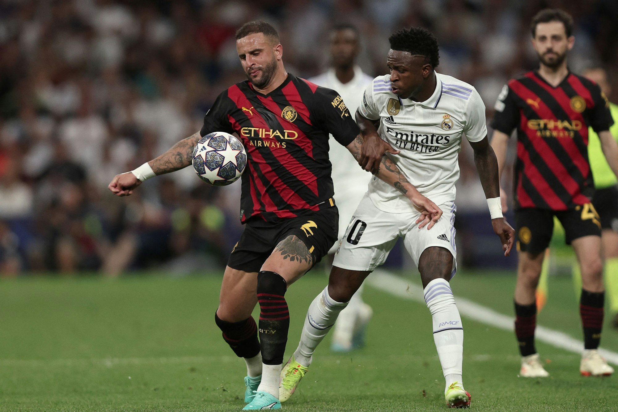Real Madrid's Vinicius Junior und Manchester City's Kyle Walker.