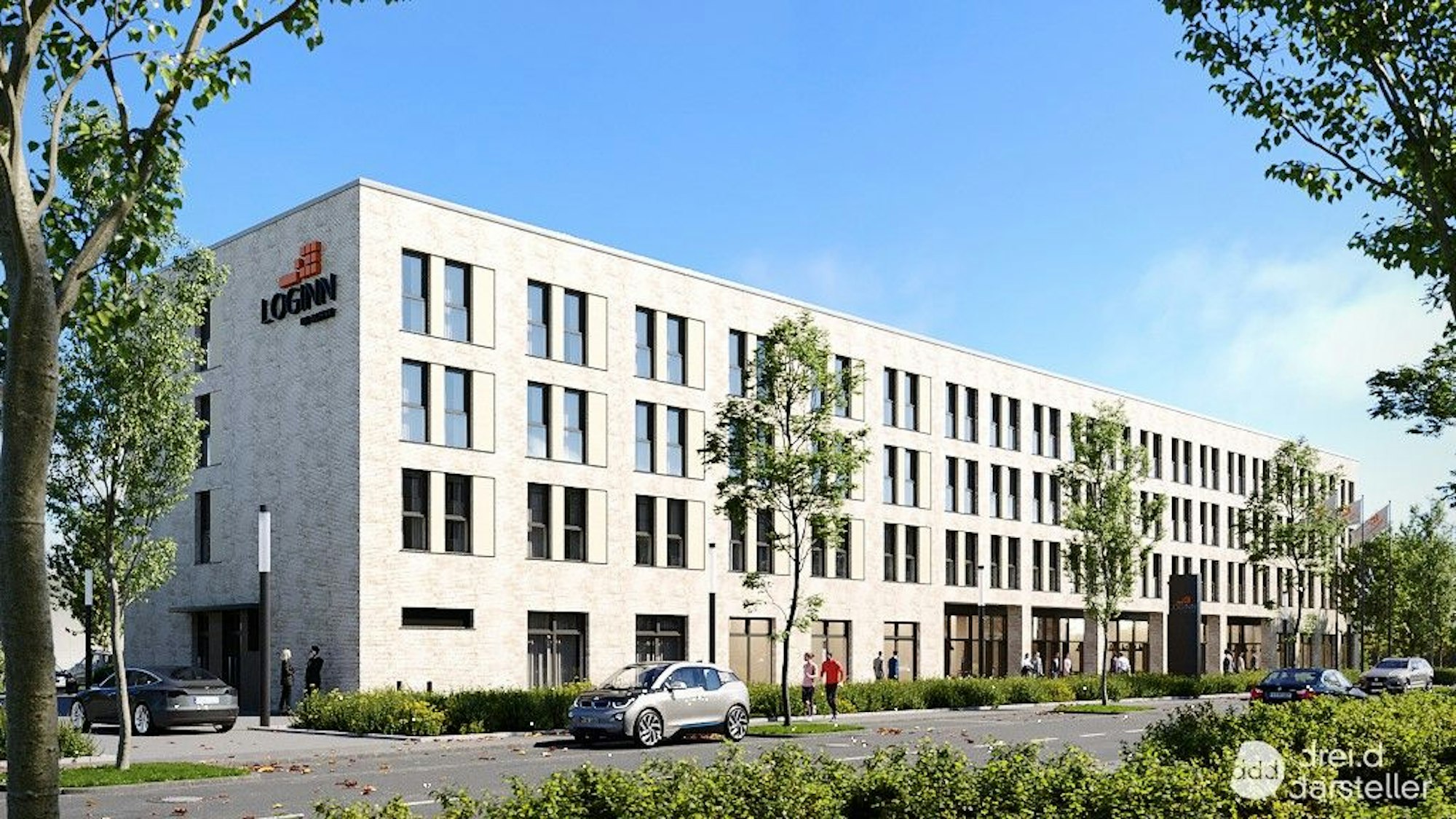 Ein rechteckiger Bau mit drei jungen Bäumen davor ist zu sehen.