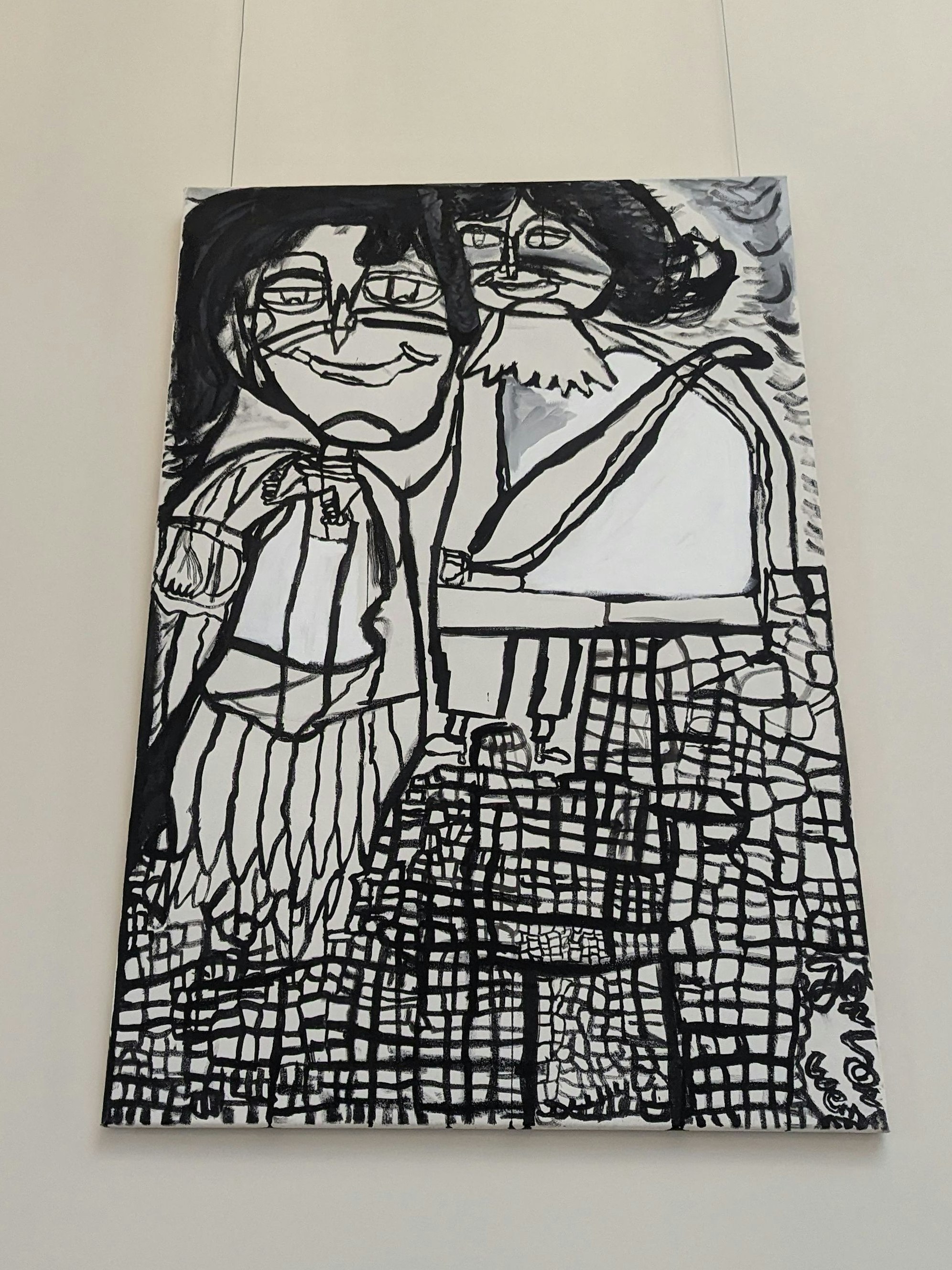 Ein abstraktes, schwarz-weißes Bild zweier Menschen.