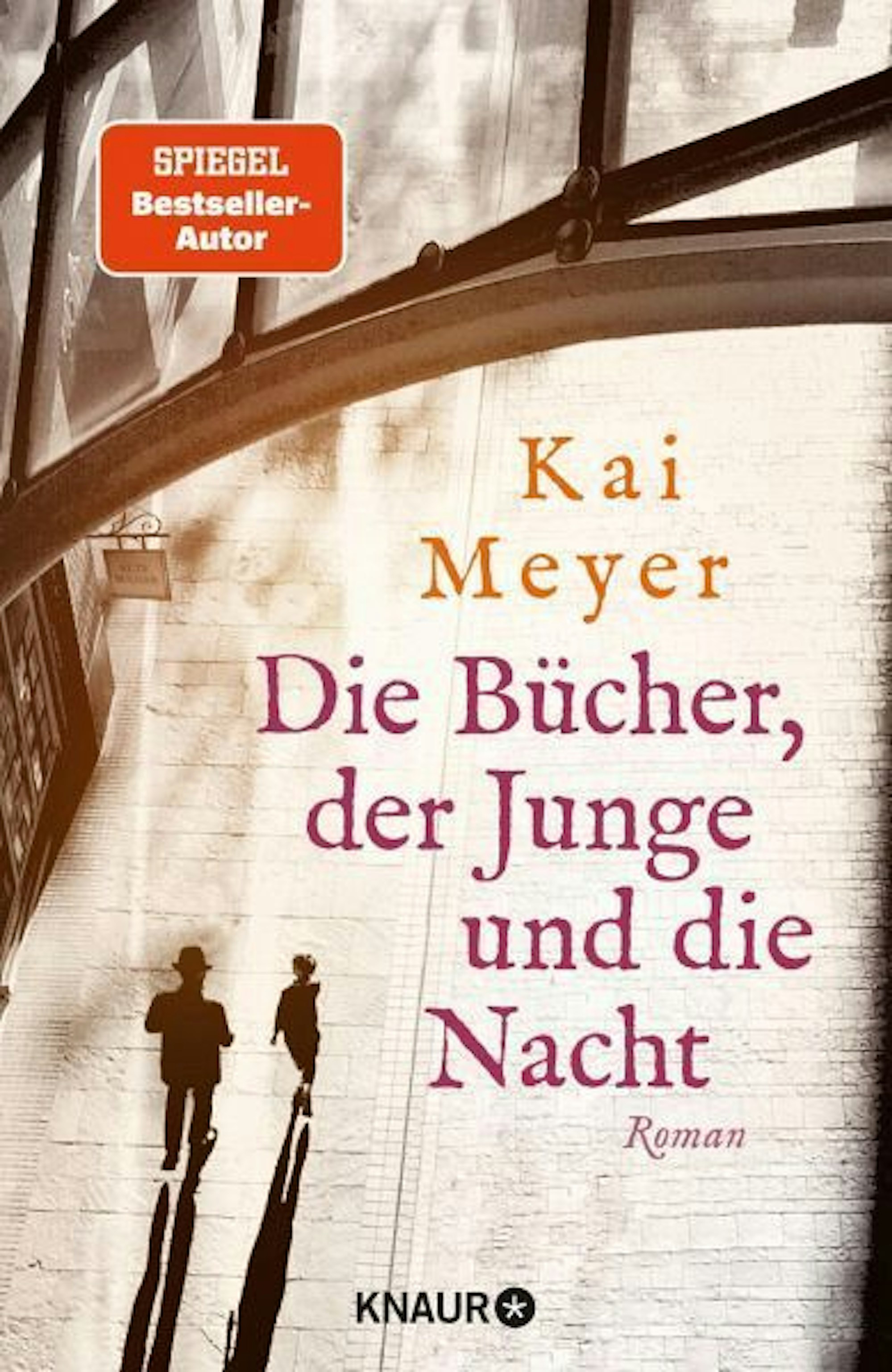 Auf diesem Buchcover sieht man im Stil einer Zeichnung und aus der Vogelperspektive einen Jungen, der neben einem Mann mit Hut läuft. Die beiden ziehen lange Schatten hinter sich her.