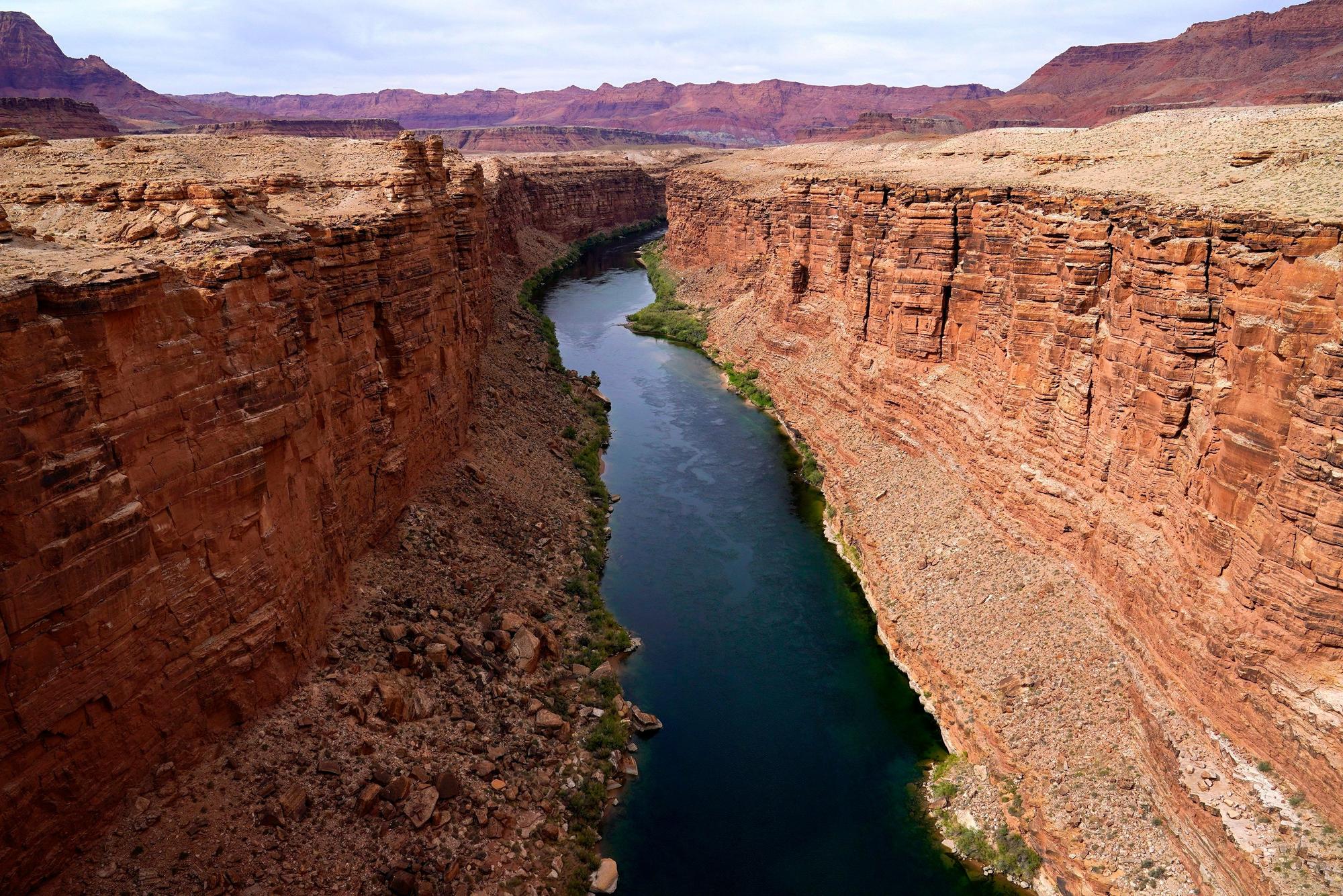 FILE - The Colorado River in the upper River Basin is pictured in Lees Ferry, Ariz., on May 29, 2021. The Supreme Court has ruled against the Navajo Nation in a dispute involving water from the drought-stricken Colorado River. States that draw water from the river — Arizona, Nevada and Colorado — and water districts in California had urged the court to decide for them, and that's what the justices did in a 5-4 ruling. (AP Photo/Ross D. Franklin, File)