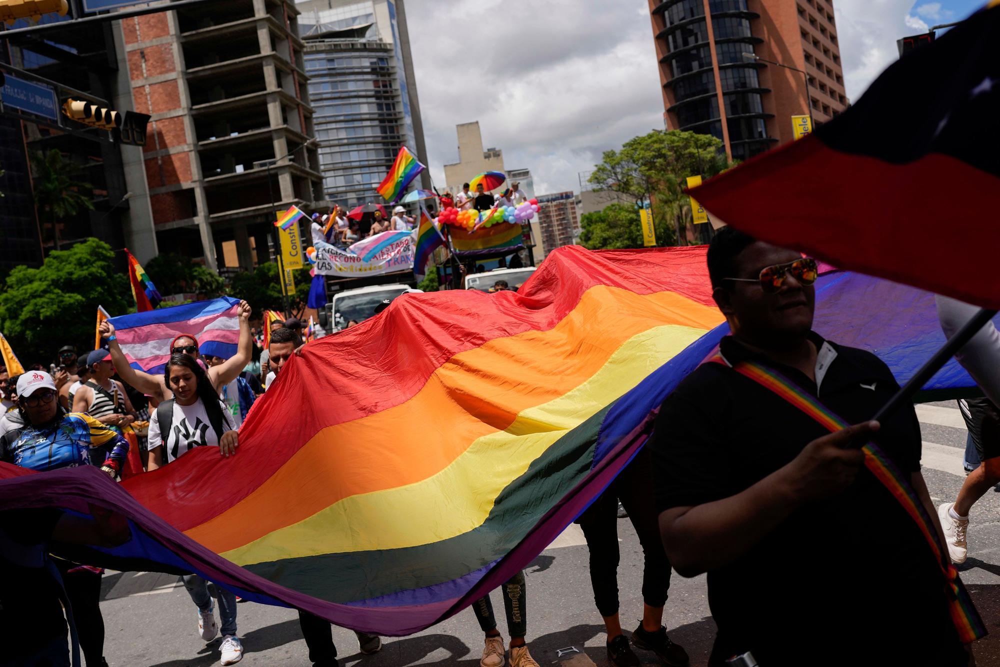 Revelers take part in the Gay Pride march in Caracas, Venezuela, Sunday, July 2, 2023. (AP Photo/Matias Delacroix)