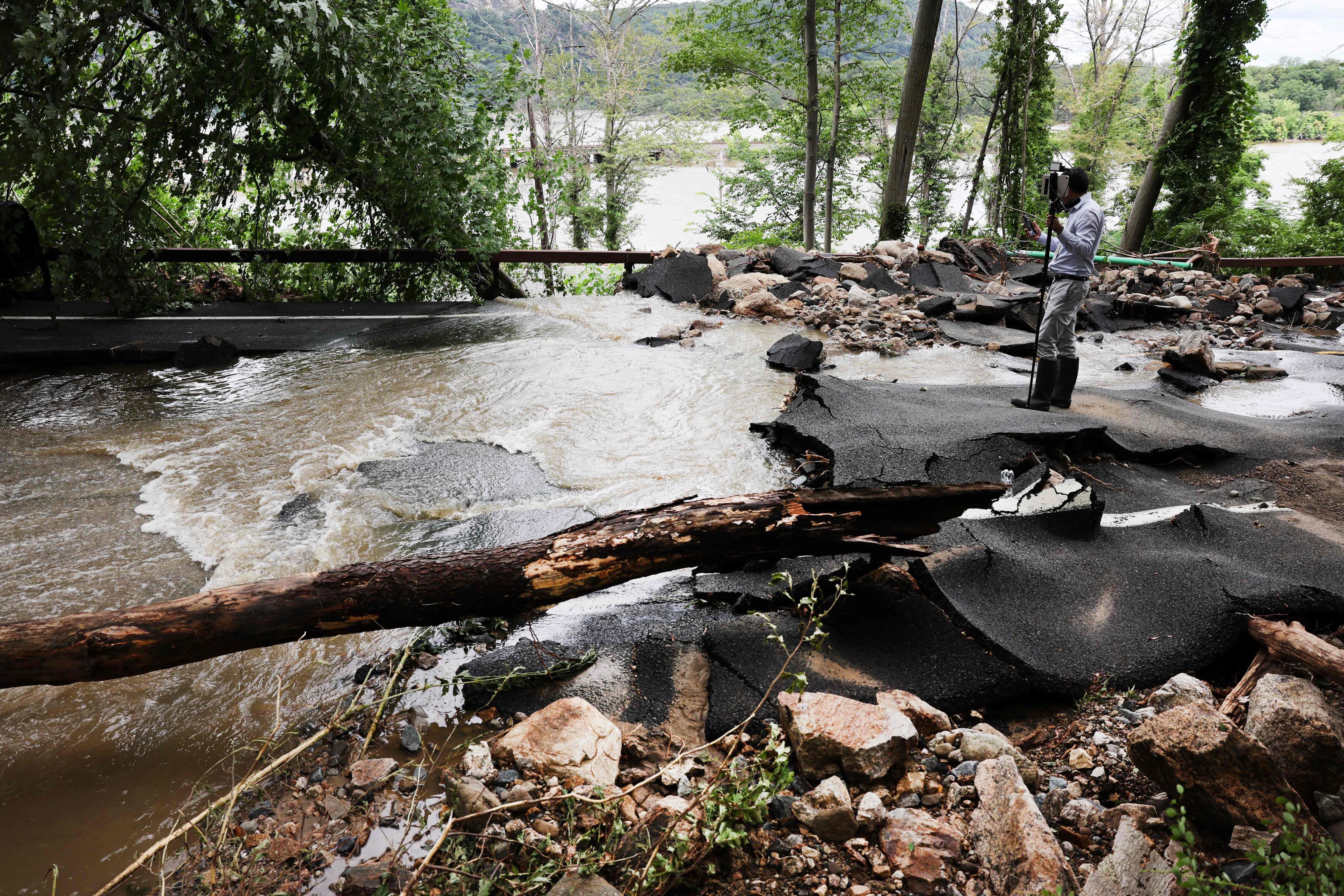 A severely damaged road is closed near Bear Mountain State Park following a night of heavy rain and flooding on July 10, 2023 in Highland Falls, New York. The storm washed out roads and bridges throughout New York State, stranding people in their homes and vehicles. One person was confirmed killed in New York Sate after being overwhelmed by water.