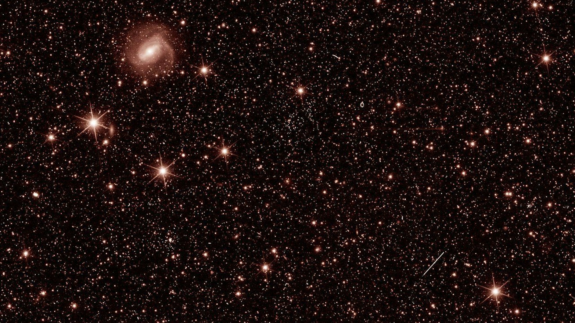 This handout photo provided courtesy of ESA/Euclid/Euclid Consortium/NASA on July 31, 2023, shows a test photo taken during commissioning of ESAs Euclid spacecraft, to check that the Near Infrared Spectrometer and Photometer (NISP) instrument is working as expected. The Euclid Space Telescope, whose mission is to study the dark matter of the Universe, reached its observation post and revealed its first test images on July 31, 2023. These images were taken to verify the operation of the scientific instruments and calibrate them, and are therefore not yet representative of the telescope's final capabilities. (Photo by ESA/Euclid/Euclid Consortium/NASA / AFP) / RESTRICTED TO EDITORIAL USE - MANDATORY CREDIT "AFP PHOTO/ESA/Euclid/Euclid Consortium/NASA" - NO MARKETING NO ADVERTISING CAMPAIGNS - DISTRIBUTED AS A SERVICE TO CLIENTS / To Go With AFP Story By Lucie AUBOURG: Euclid Space Telescope reveals its first test images