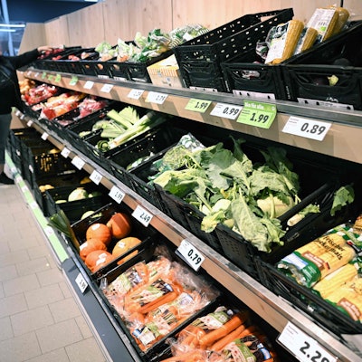 A woman chooses products from the fruit and vegetable counter at a store of the Penny supermarket chain in Berlin, Germany, on August 1, 2023.