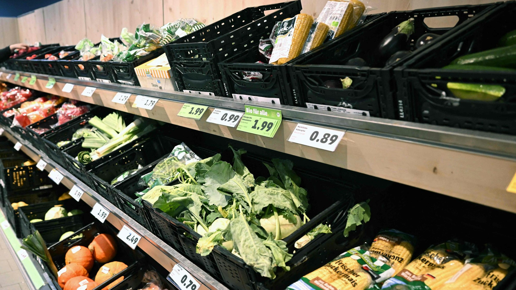 A woman chooses products from the fruit and vegetable counter at a store of the Penny supermarket chain in Berlin, Germany, on August 1, 2023.