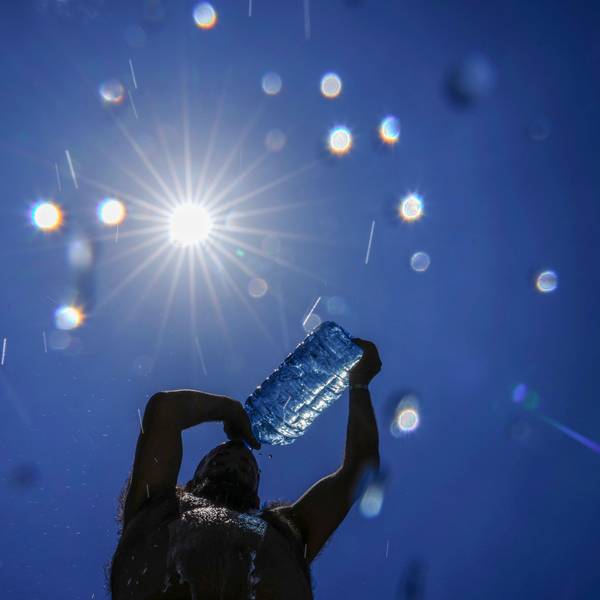 FILE - A man pours cold water onto his head to cool off on a sweltering hot day in the Mediterranean Sea in Beirut, Lebanon, July 16, 2023. European climate monitoring organization made it official: July 2023 was Earth's hottest month on record by a wide margin. (AP Photo/Hassan Ammar, File)
