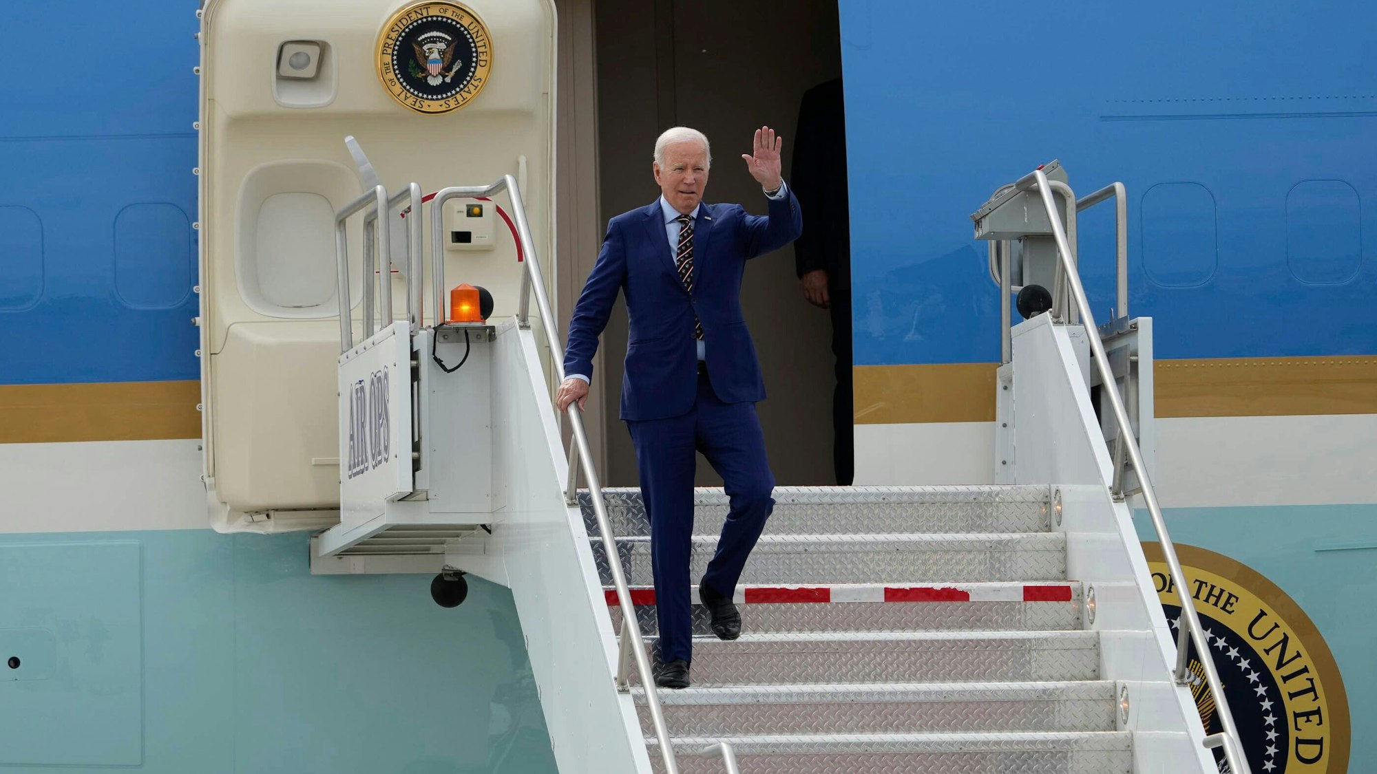 President Joe Biden exits Air Force One after landing at Roland R. Wright Air National Guard Base, Wednesday, Aug. 9, 2023, in Salt Lake City. (Francisco Kjolseth/The Salt Lake Tribune via AP)