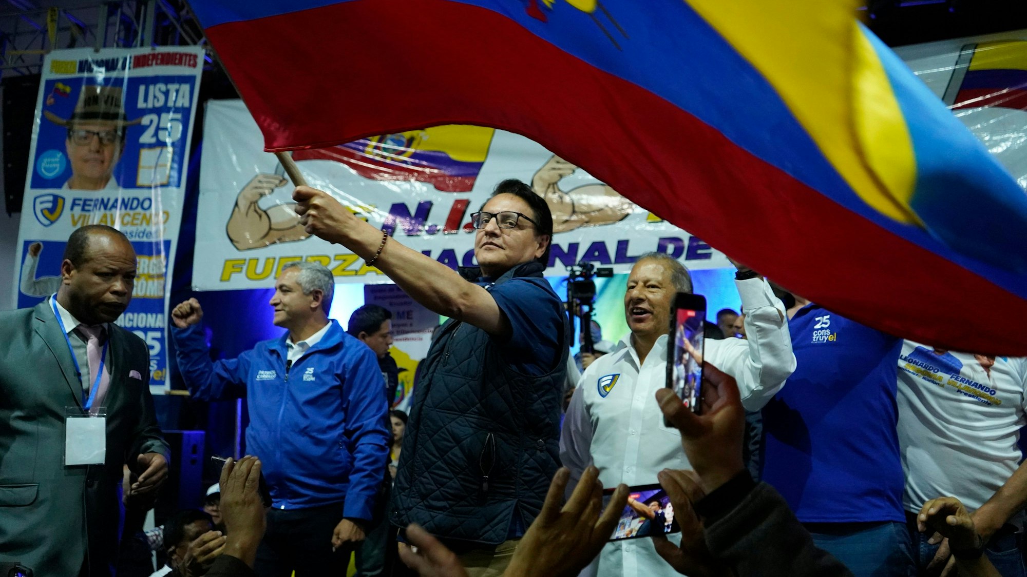 FILE - Presidential candidate Fernando Villavicencio waves a national flag during a campaign event at a school minutes before he was shot to death outside the same school, in Quito, Ecuador, Aug. 9, 2023. Villavicencio was fatally shot in broad daylight despite a security detail that included police and bodyguards. (API via AP File)