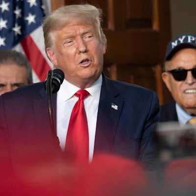 (FILES) President Donald Trump's personal lawyer Rudy Giuliani listens as US President Donald Trump delivers remarks to the City of New York Police Benevolent Association at the Trump National Golf Club in Bedminster, NJ, on August 14, 2020. Donald Trump was indicted August 14, 2023 on charges of racketeering and a string of election crimes after a sprawling two-year probe into his efforts to overturn his 2020 defeat to Joe Biden in the US state of Georgia, according to a court filing.
The indictment named a number of co-defendants including Trump's former personal lawyer Rudy Giuliani, who pressured local legislators over the result after the election, and Trump's White House chief of staff, Mark Meadows. (Photo by JIM WATSON / AFP)