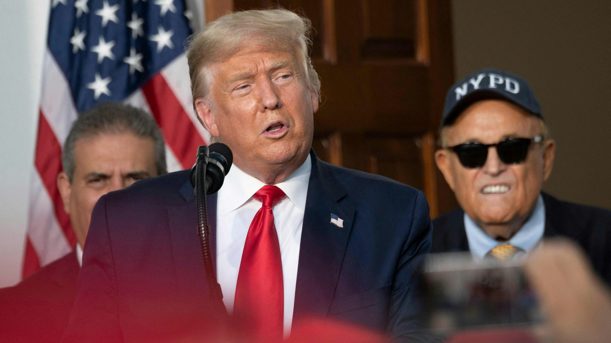 (FILES) President Donald Trump's personal lawyer Rudy Giuliani listens as US President Donald Trump delivers remarks to the City of New York Police Benevolent Association at the Trump National Golf Club in Bedminster, NJ, on August 14, 2020. Donald Trump was indicted August 14, 2023 on charges of racketeering and a string of election crimes after a sprawling two-year probe into his efforts to overturn his 2020 defeat to Joe Biden in the US state of Georgia, according to a court filing.
The indictment named a number of co-defendants including Trump's former personal lawyer Rudy Giuliani, who pressured local legislators over the result after the election, and Trump's White House chief of staff, Mark Meadows. (Photo by JIM WATSON / AFP)