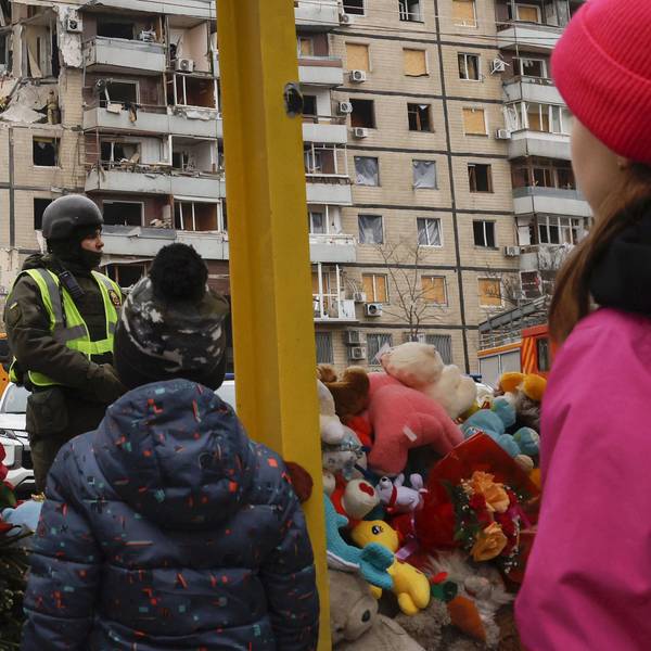 Scene in Ukraine Children look at an apartment building struck by a missile in Dnipro on Jan. 17, 2023, amid Russia's war on Ukraine.