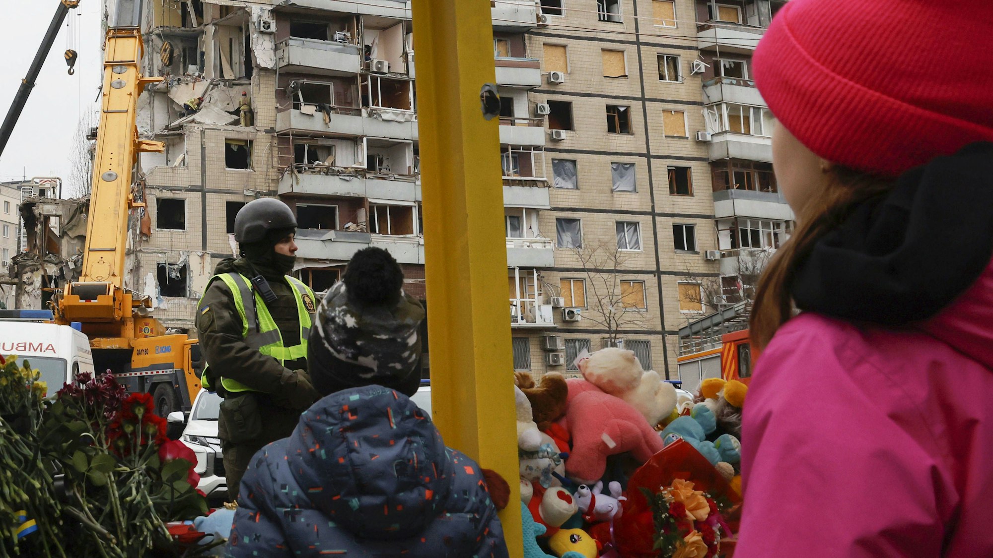 Scene in Ukraine Children look at an apartment building struck by a missile in Dnipro on Jan. 17, 2023, amid Russia's war on Ukraine.