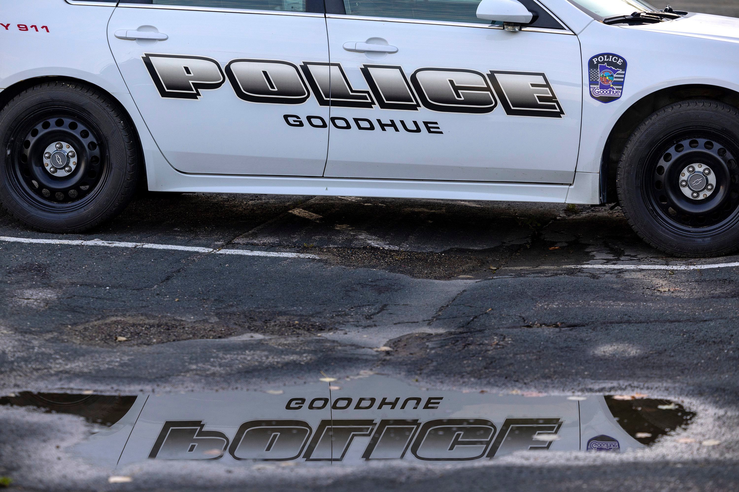 A Goodhue police car is parked outside City Hall on Monday, Aug. 14, 2023, in Goodhue, Minn. The small  town will soon be without a police department, an exodus spurred by low pay for the chief and his officers. (Carlos Gonzalez/Star Tribune via AP)