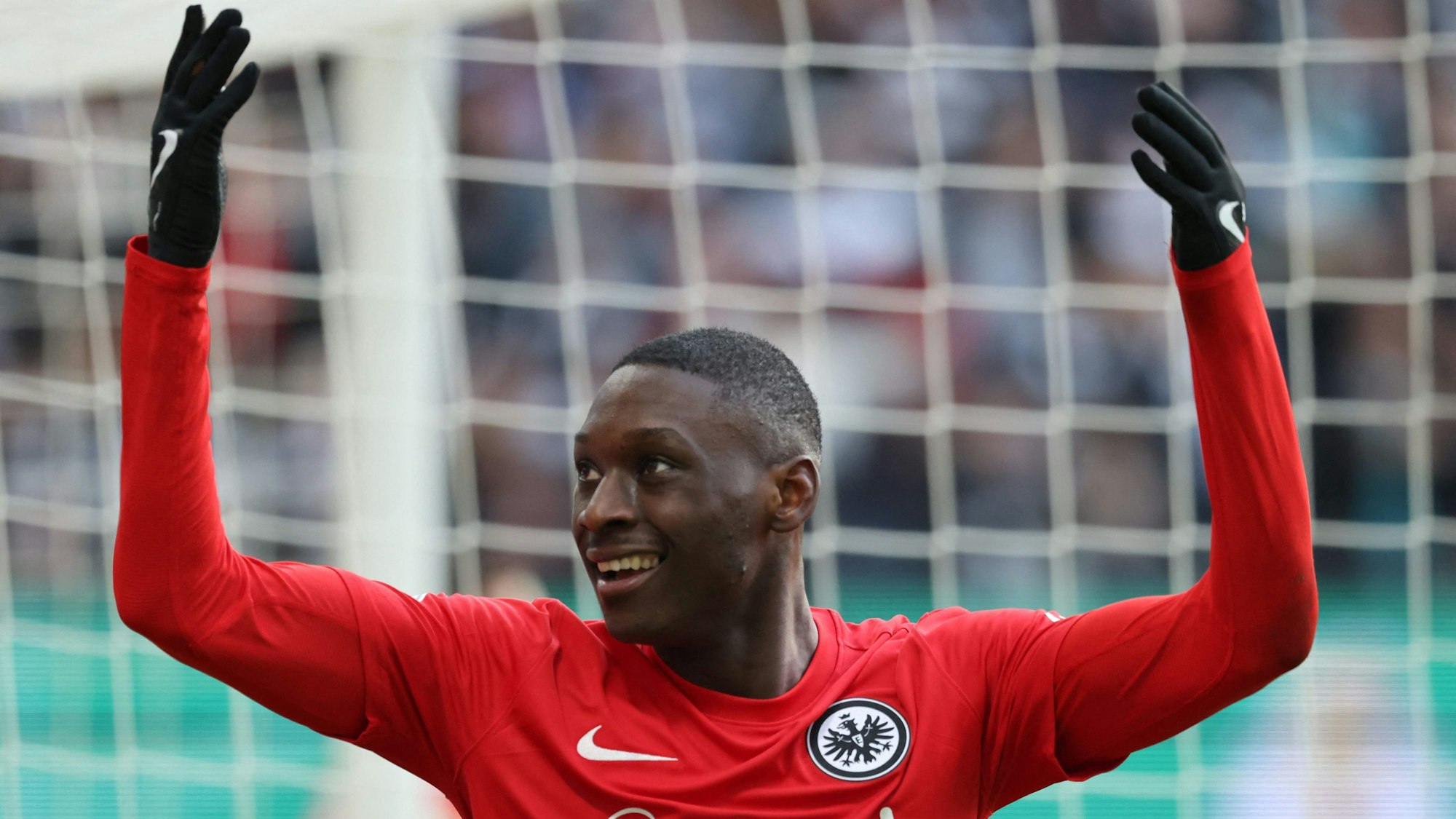 (FILES) Frankfurt's French forward Randal Kolo Muani celebrates scoring the 2-0 goal with his team-mates during the German Cup (DFB Pokal) quarter-final football match Eintracht Frankfurt v Union Berlin in Frankfurt, western Germany on April 4, 2023. Paris Saint-Germain announced the signing of France striker Randal Kolo Muani from German club Eintracht Frankfurt early on September 2nd, moments after the summer transfer window closed in Europe.
Kolo Muani, 24, has signed a five-year contract with the French champions. (Photo by Daniel ROLAND / AFP) / DFL REGULATIONS PROHIBIT ANY USE OF PHOTOGRAPHS AS IMAGE SEQUENCES AND/OR QUASI-VIDEO