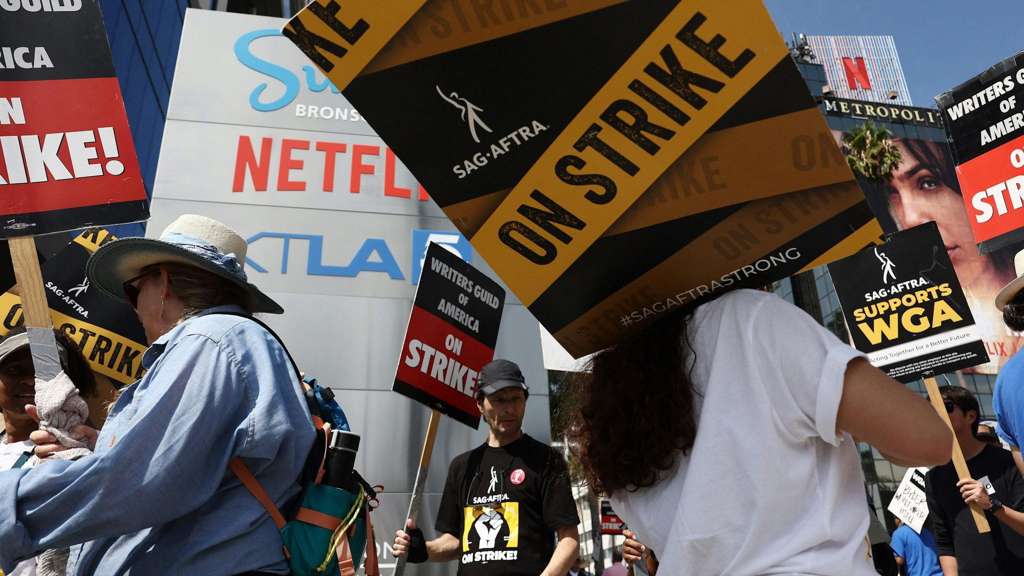 Striking WGA (Writers Guild of America) members picket with striking SAG-AFTRA members outside Netflix studios on September 22, 2023 in Los Angeles, California. The Writers Guild of America and Alliance of Motion Picture and Television Producers (AMPTP) are reportedly meeting for a third straight day today in a new round of contract talks in the nearly five-months long writers strike.