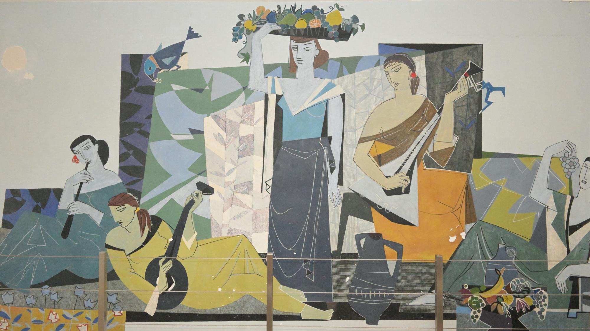 Das Wandbild „Lebensfreude“ zeigt im Stil der 1950er Jahre drei musizierende Frauen, sowie eine Frau, die einen Korb mit Früchten auf dem Kopf balanciert.