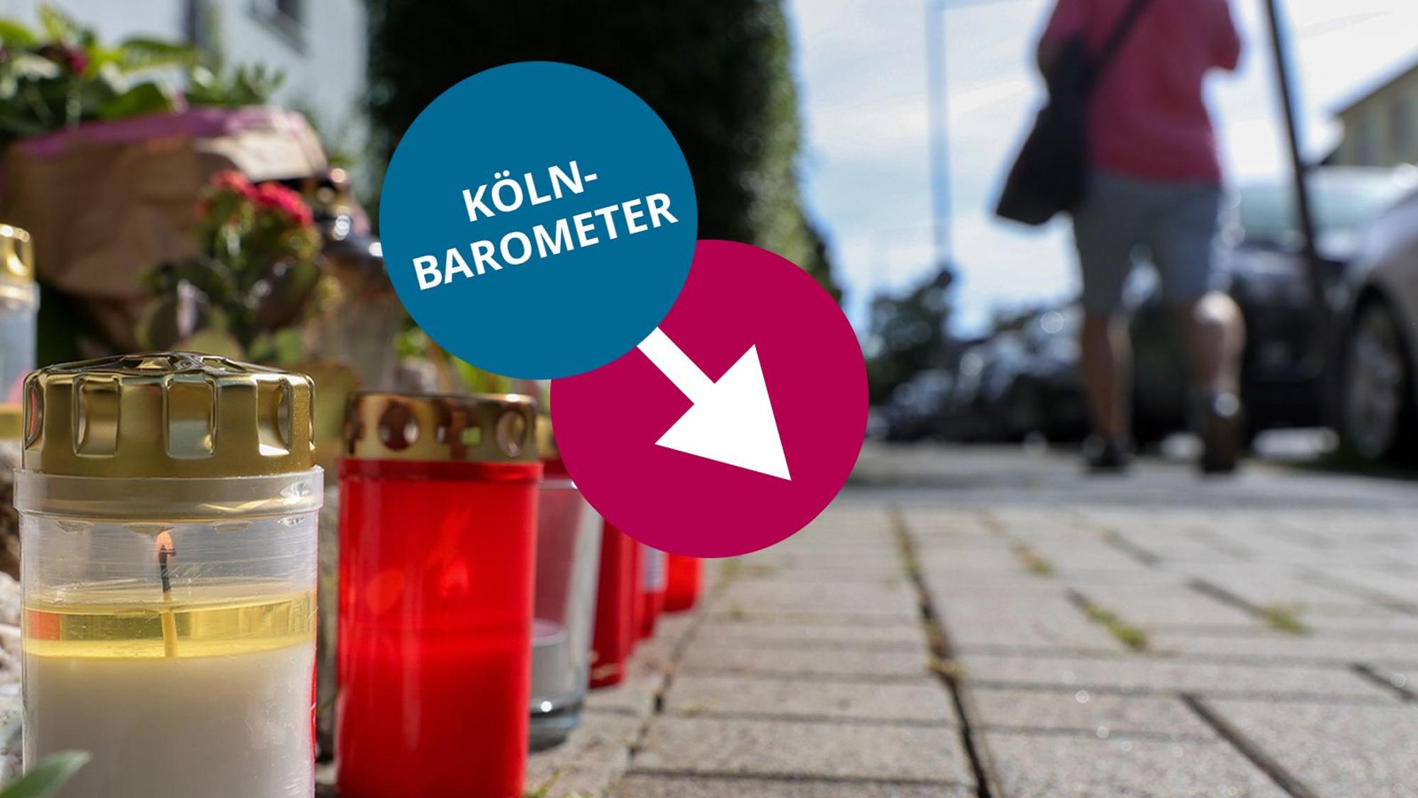 Kerzen stehen vor einem Hauseingang in der Römerstraße, die an den gewaltsamen Tod eines 19-Jährigen erinnern.