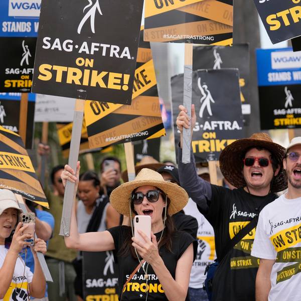 File - People picketing on behalf of the Screen Actors Guild-American Federation of Television and Radio Artists carry signs outside Netflix on Sept. 27, 2023, in Los Angeles. From auto production lines to Hollywood, the power of labor unions is back in the national spotlight. (AP Photo/Chris Pizzello, File)