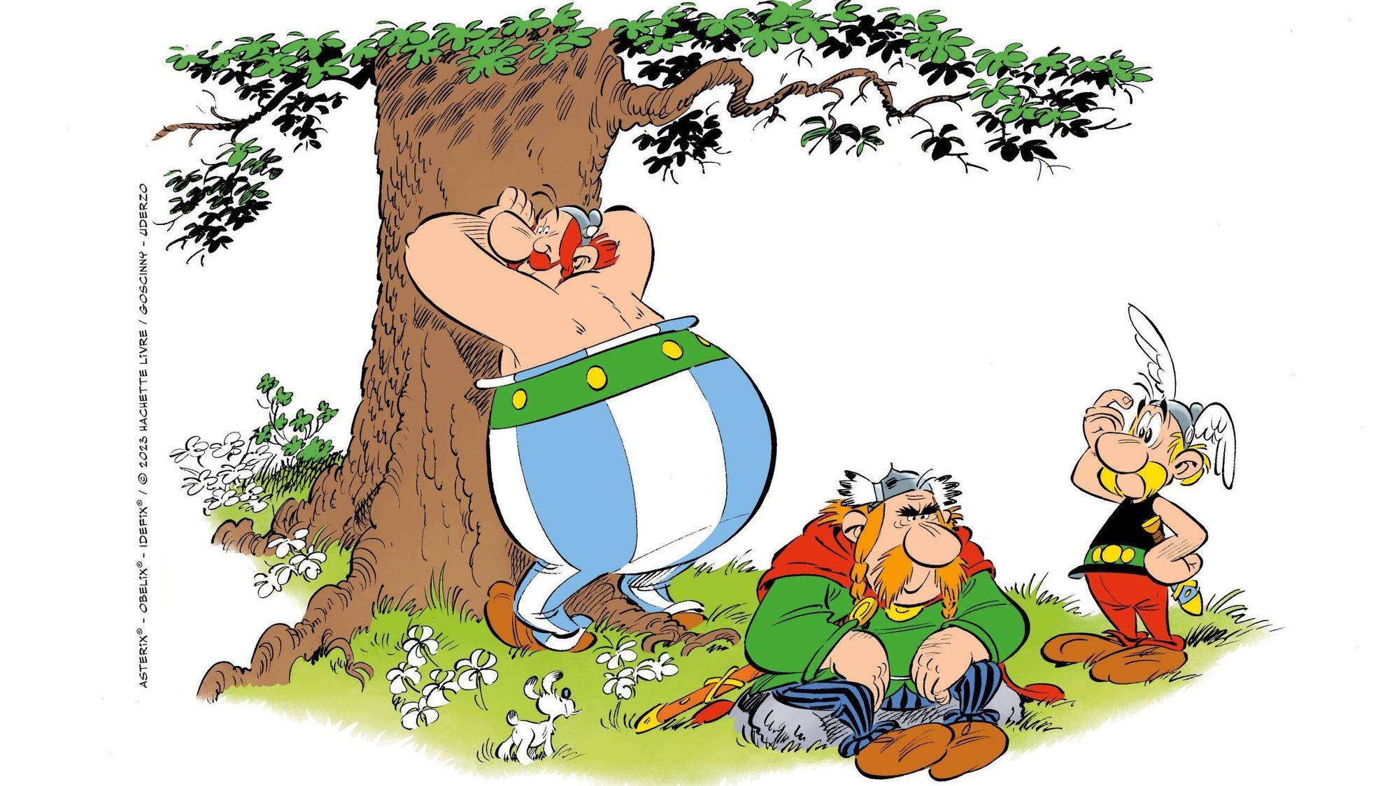 Das Bild aus dem Asterix-Band „Die weiße Iris“ zeigt Obelix an einem Baum lehnend, Majestix, der auf einem Stein sitzt und schmollt und Asterix der sich an die Stirn tippt.