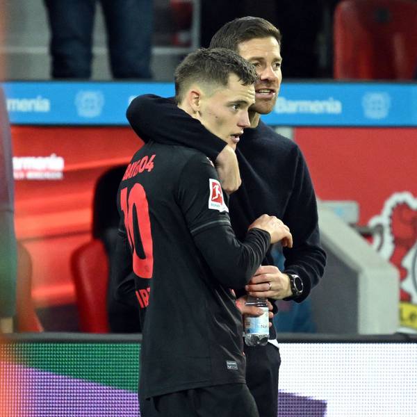 Bayer Leverkusen's German midfielder #10 Florian Wirtz (L) speaks with Bayer Leverkusen's Spanish coach Xabi Alonso during the German first division Bundesliga football match between Bayer 04 Leverkusen and SC Freiburg in Leverkusen, western Germany on October 29, 2023. (Photo by INA FASSBENDER / AFP) / DFL REGULATIONS PROHIBIT ANY USE OF PHOTOGRAPHS AS IMAGE SEQUENCES AND/OR QUASI-VIDEO