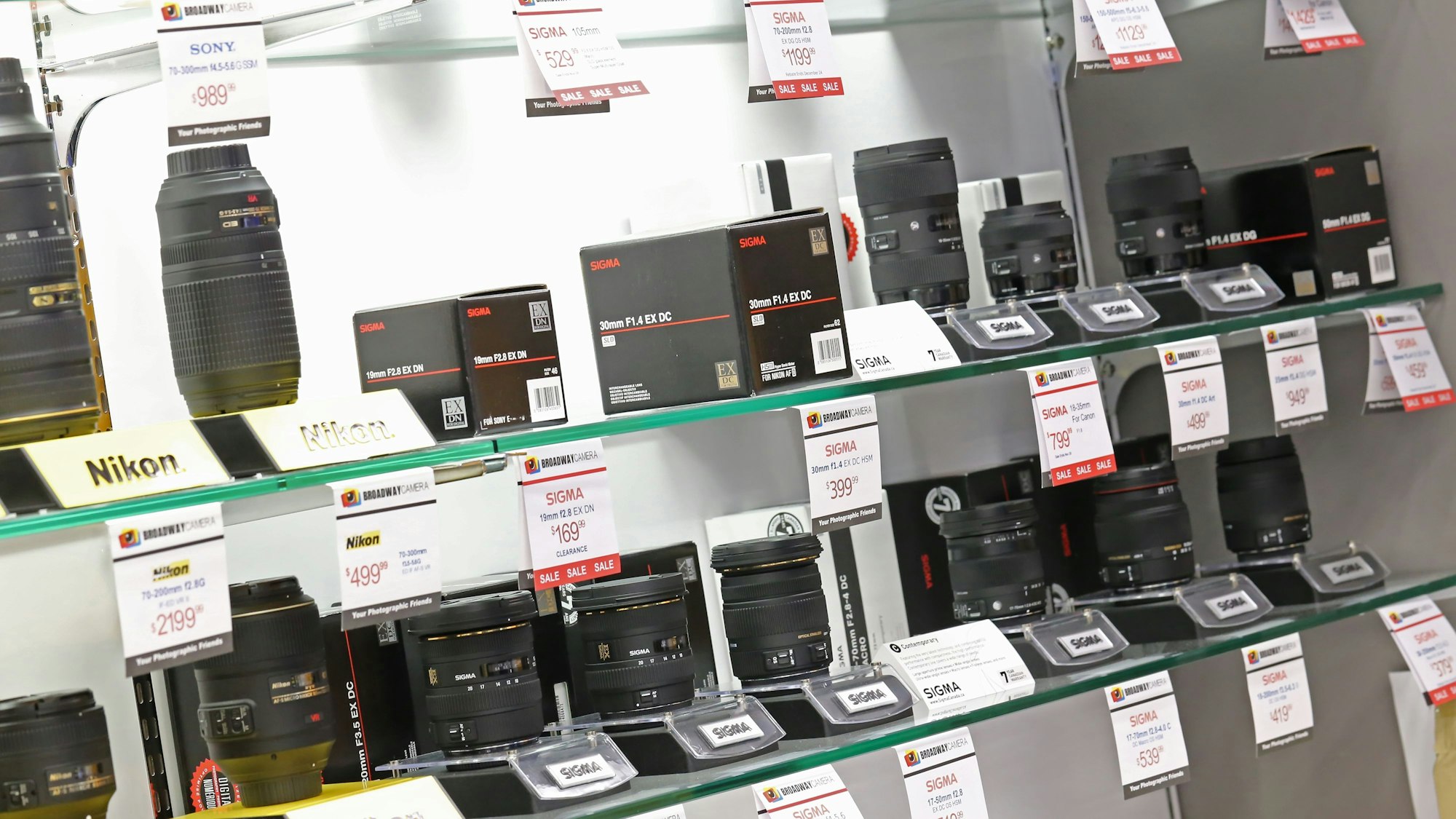 coquitlam - november 26: display camera lens in broadway camera coquitlam store on november 26, 2013 in coquitlam bc, canada. xkwx broadway camera, business, buy, cameras, canon, chain, commerce, commercial, consumer, customer, deal, digital, dslr, electronics, inc, japan, japanese, large, lenses, lot, many, market, model, modern, new, nobody, photo, photographer, photography, prices, production, products, purchase, retail, retailer, sale, sell, service, shop, shopper, showcase, store, tech, technology, tokyo, trade, vendor