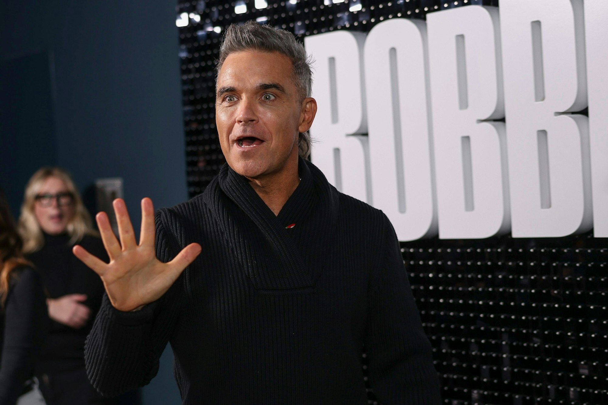 Robbie Williams poses for photographers upon arrival at the premiere for the Robbie Williams documentary on Wednesday, Nov. 1, 2023 in London. (Vianney Le Caer/Invision/AP)