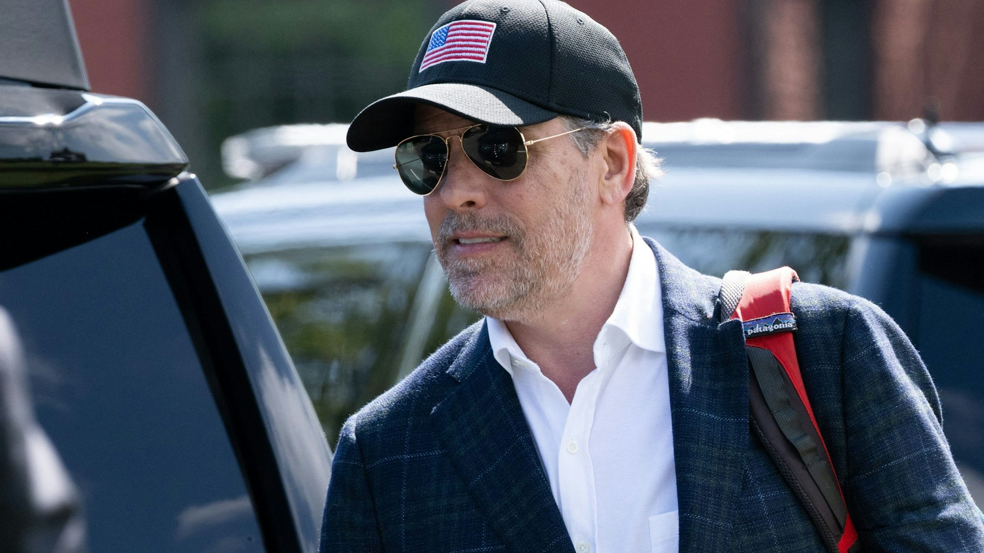 (FILES) (FILES) Hunter Biden walks to a waiting SUV after arriving with US President Joe Biden on Marine One at Fort McNair in Washington, DC, on July 4, 2023. Hunter Biden was indicted late December 7, 2023 on nine counts of tax evasion, the second time this year President Joe Biden's troubled son has been charged by a special counsel investigating his personal and business dealings. (Photo by SAUL LOEB / AFP)
