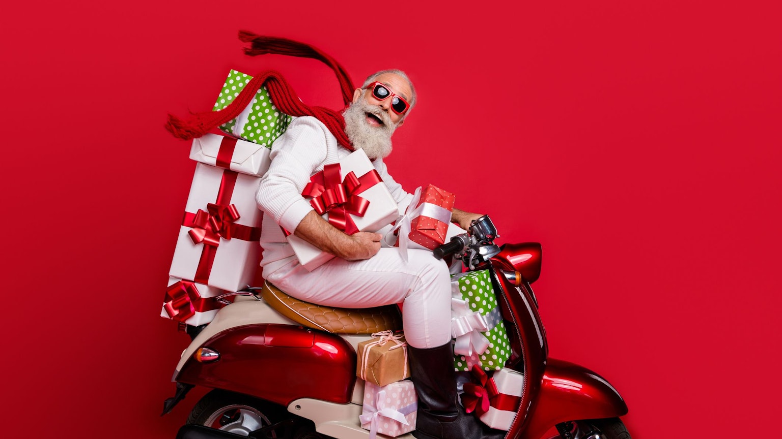 Profile side view of nice attractive funny funky cheery positive bearded gray-haired man driving motor carrying desirable purchase on-time air wind blows isolated on bright vivid shine red background