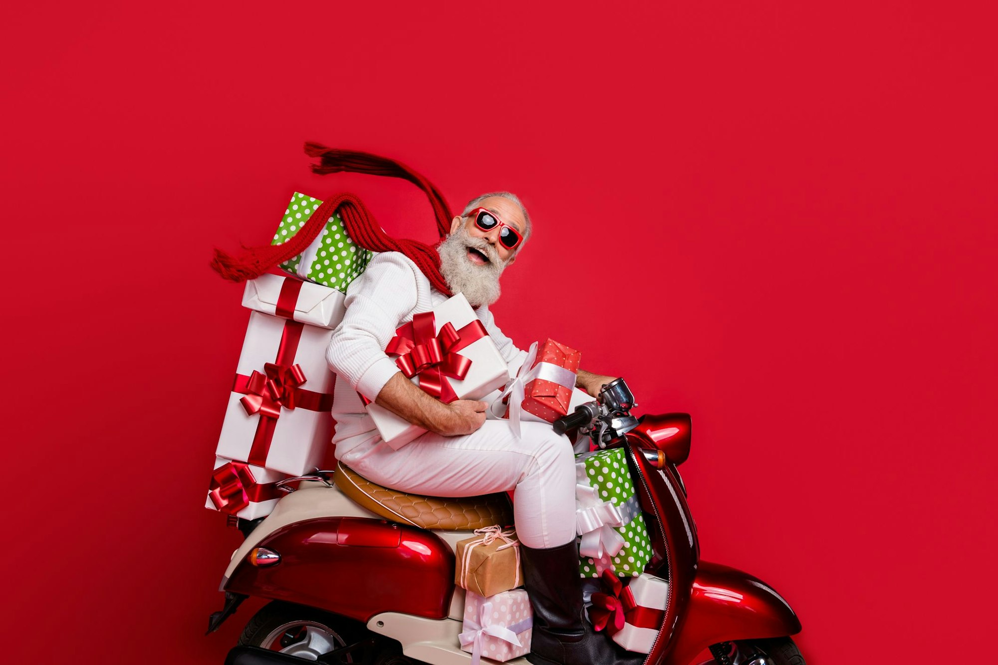 Profile side view of nice attractive funny funky cheery positive bearded gray-haired man driving motor carrying desirable purchase on-time air wind blows isolated on bright vivid shine red background