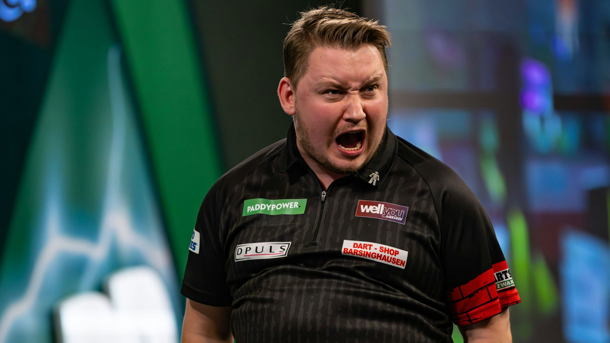 Martin Schindler jubelt während seiner Partie gegen Scott Williams. Am Ende unterlag der Deutsche dem Briten.