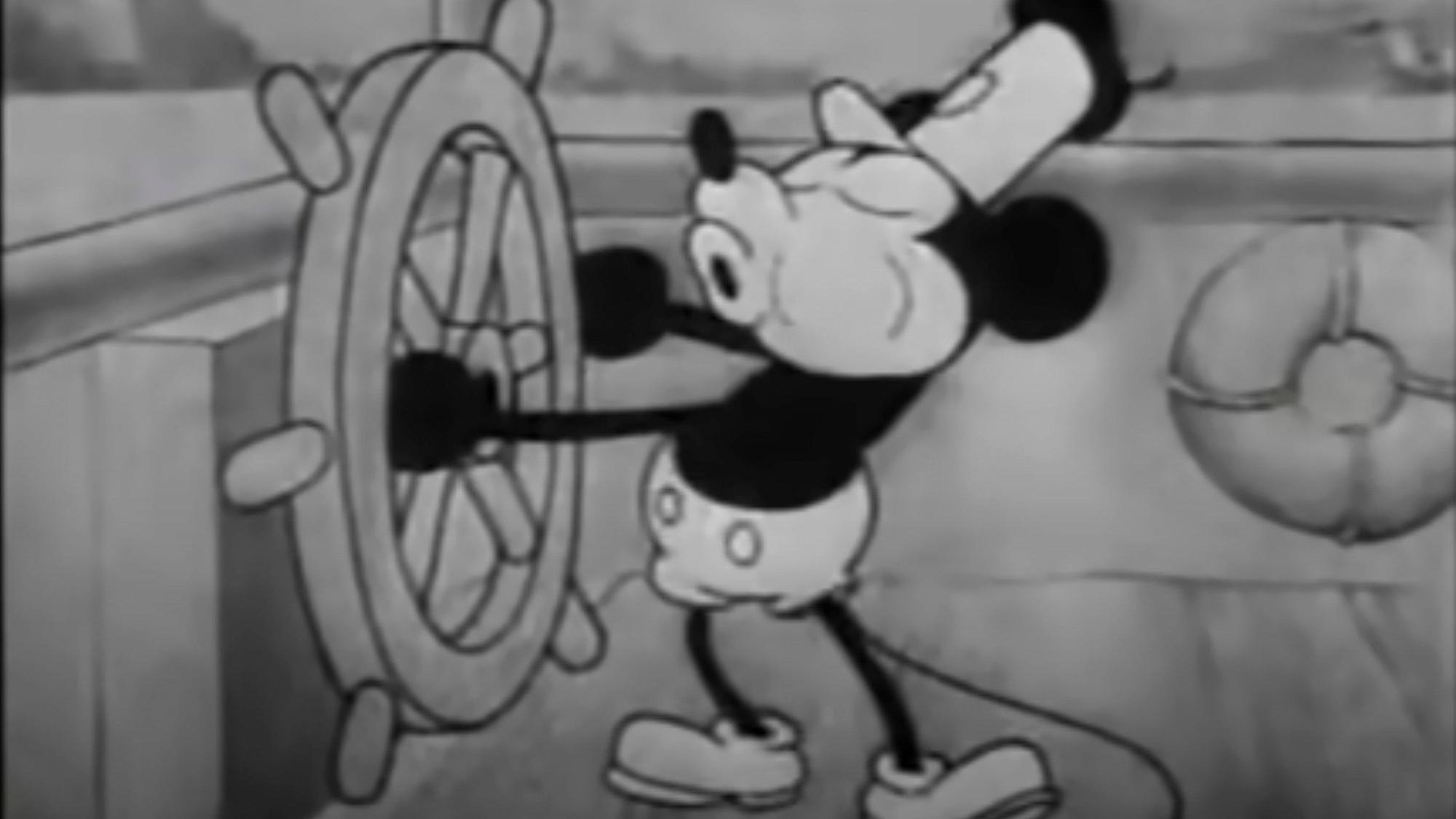 This still image from video provided by Disney shows the character Mickey Mouse in the 1928 animated short "Steamboat Willie." On Monday, Jan. 1, 2024, the iconic character from “Steamboat Willie” entered the public domain after the expiration of the 95-year copyright, and is already the focus of two horror films. (Disney via AP)