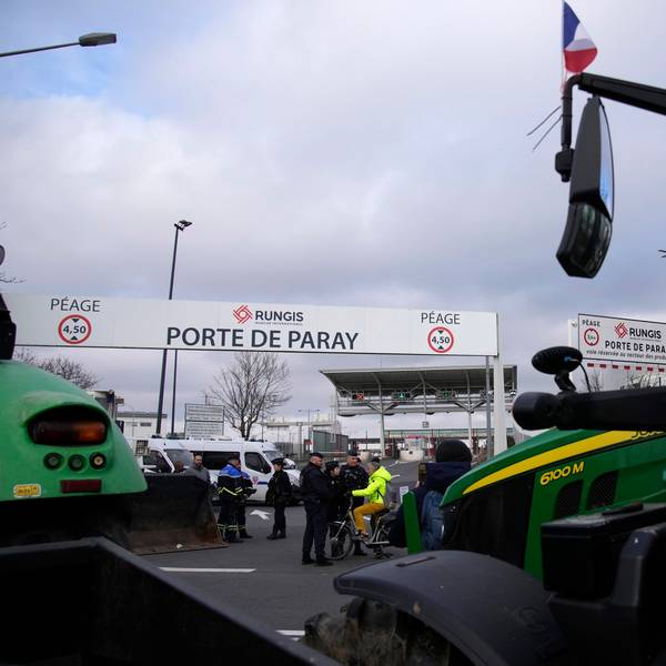 Tractors park outside the Rungis international market, which supplies the capital and surrounding region with much of its fresh food, Wednesday, Jan. 31, 2024 in Rungis, south of Paris. French farmers maintained their protests on major roads around Paris and across the country on Wednesday as police was deployed to protect the capital, its airports and an international market. (AP Photo/Christophe Ena)