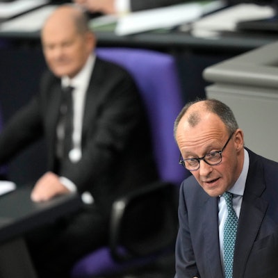 Opposition Christian Union parties floor leader Friedrich Merz, right, speaks, as German Chancellor Olaf Scholz, listens during a general debate on the budget at the German parliament Bundestag in Berlin, Germany, Wednesday, Jan. 31, 2024. (AP Photo/Ebrahim Noroozi)