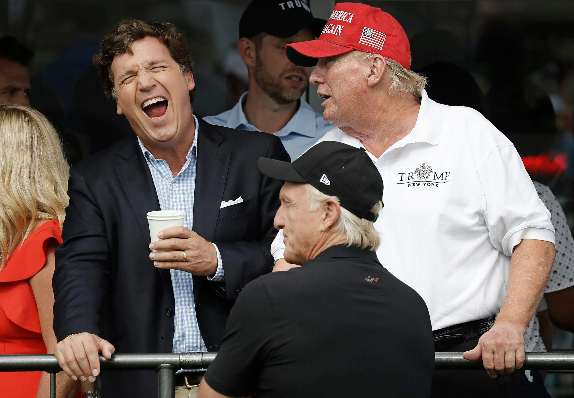 Fox TV host Tucker Carlson, left, laughs as he speaks with Former President Donald J. Trump at LIV Golf Bedminster invitational, part of the new LIV Golf Invitational Series, at the Trump National Golf Club on Sunday, July, 31 2022 in Bedminster, New Jersey.. PUBLICATIONxINxGERxSUIxAUTxHUNxONLY NYP202207311021 PETERxFOLEY