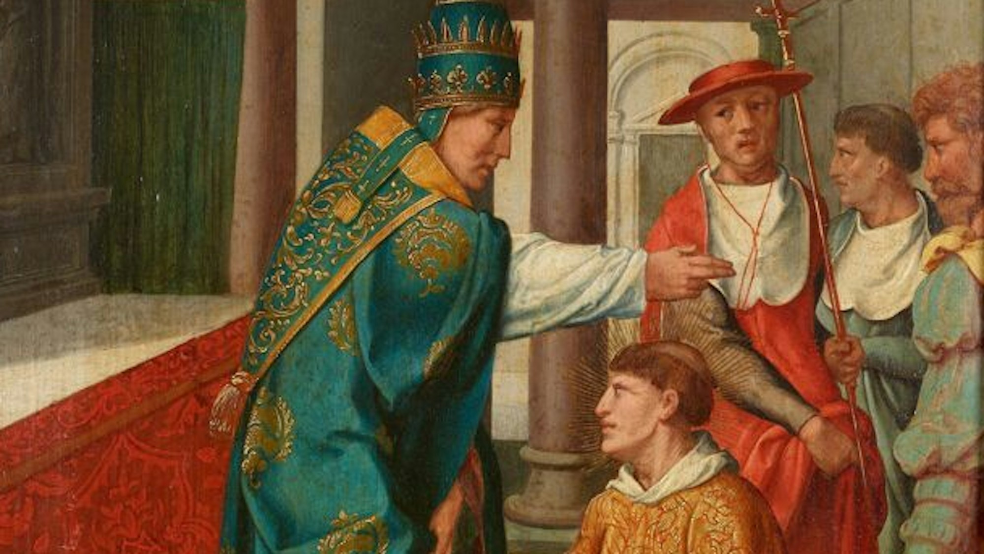 Ein Papst weiht einen vor ihm knienden Mann.