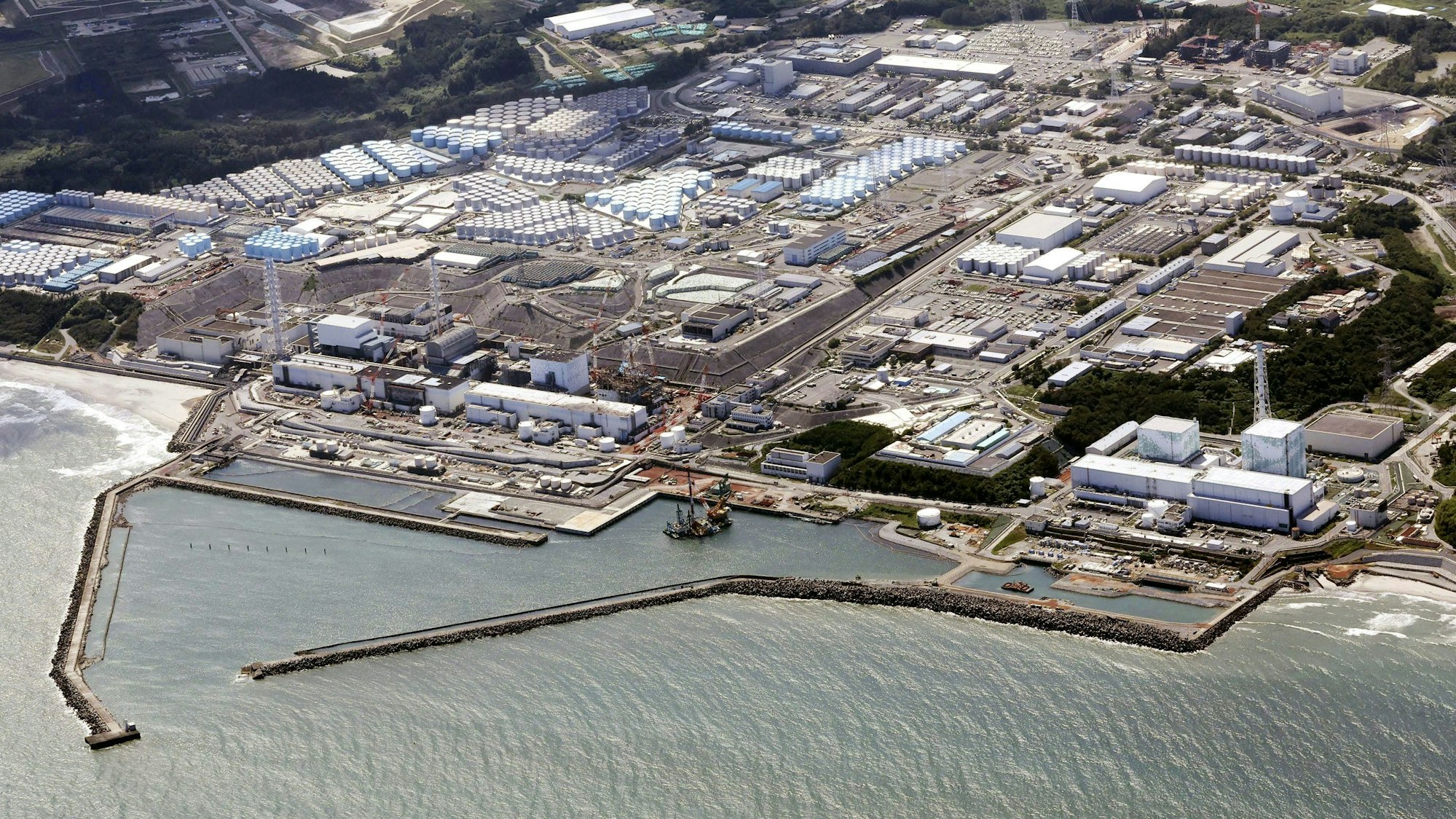 FILE - This aerial view shows the Fukushima Daiichi nuclear power plant in Fukushima, northern Japan, on Aug. 24, 2023, shortly after its operator Tokyo Electric Power Company Holdings TEPCO began releasing its first batch of treated radioactive water into the Pacific Ocean. Japan's wrecked Fukushima nuclear power plant said it began releasing a second batch of treated radioactive wastewater into the sea on Thursday, Oct 5, 2023, after the first round of discharges ended smoothly.(Kyodo News via AP, File)