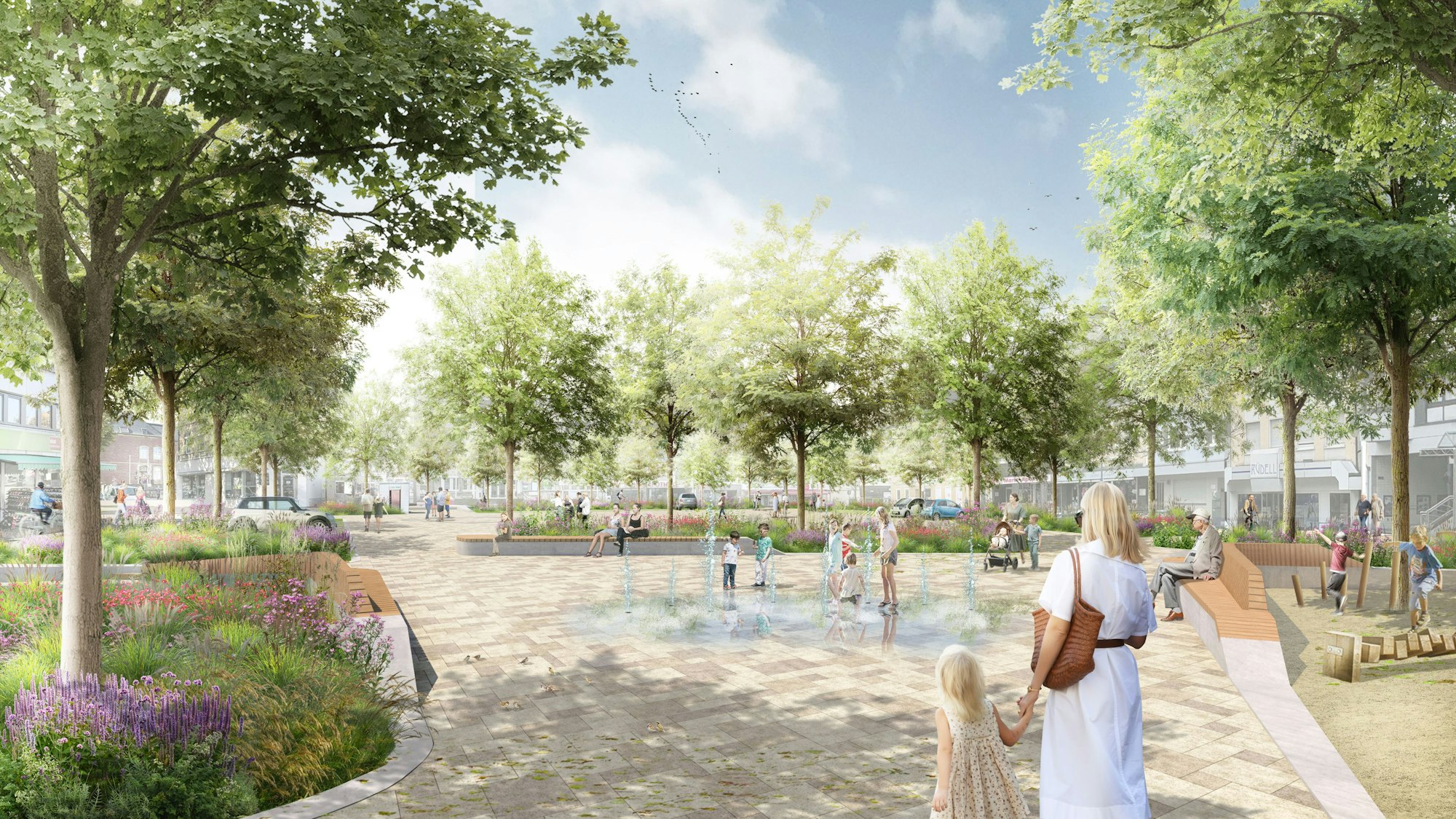 Eine Visualisierung zeigt einen Platz mit vielen Bäumen und Stauden und helles Pflaster mit einem Fontänenfeld.