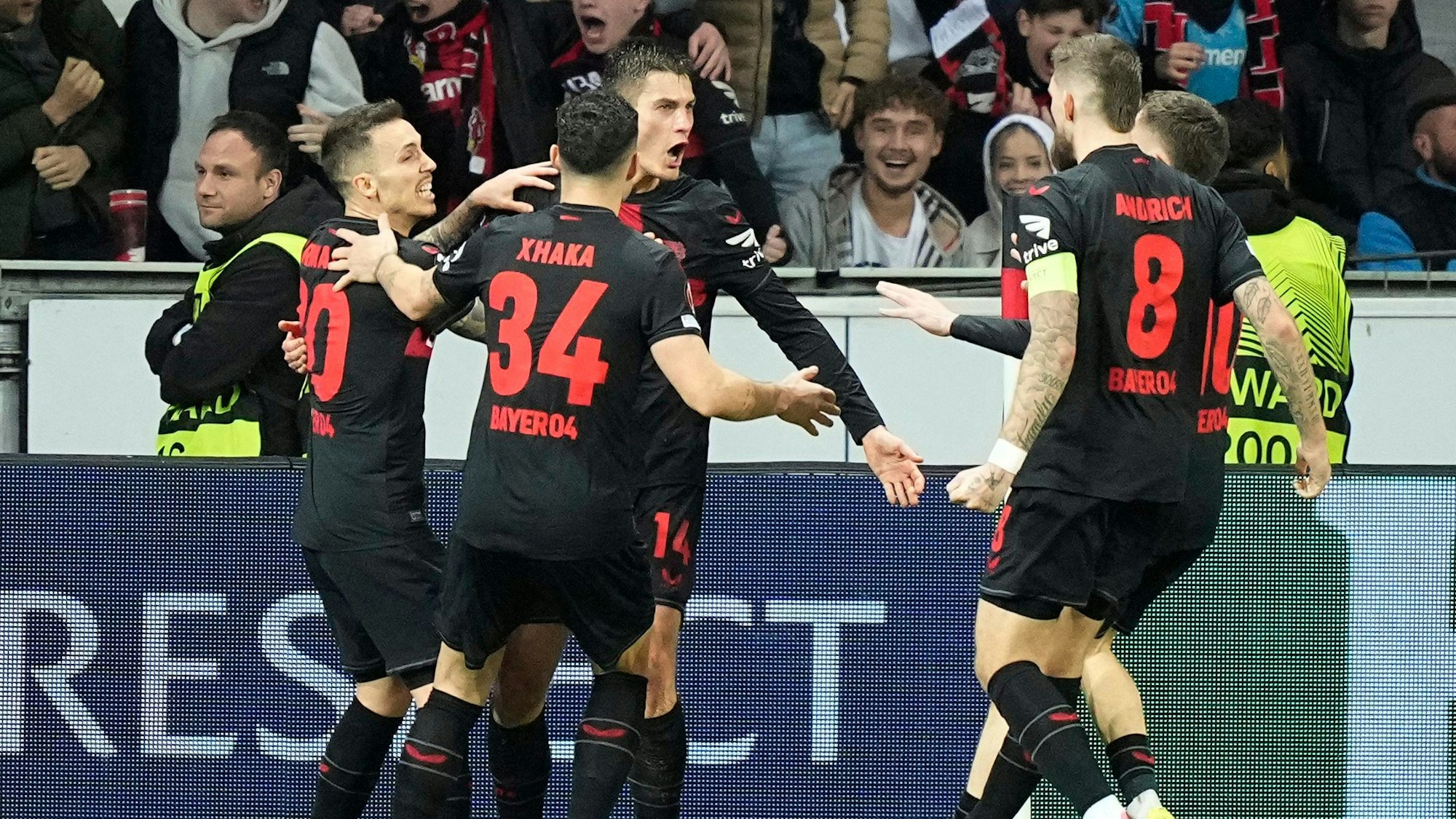 Leverkusen's Patrik Schick, 3rd from left, celebrates after scoring his side's second goal during the Europa League round of sixteen, second leg, soccer match between Bayer Leverkusen and Qarabag FK at the BayArena in Leverkusen, Germany, Thursday, March 14, 2024. (AP Photo/Martin Meissner)